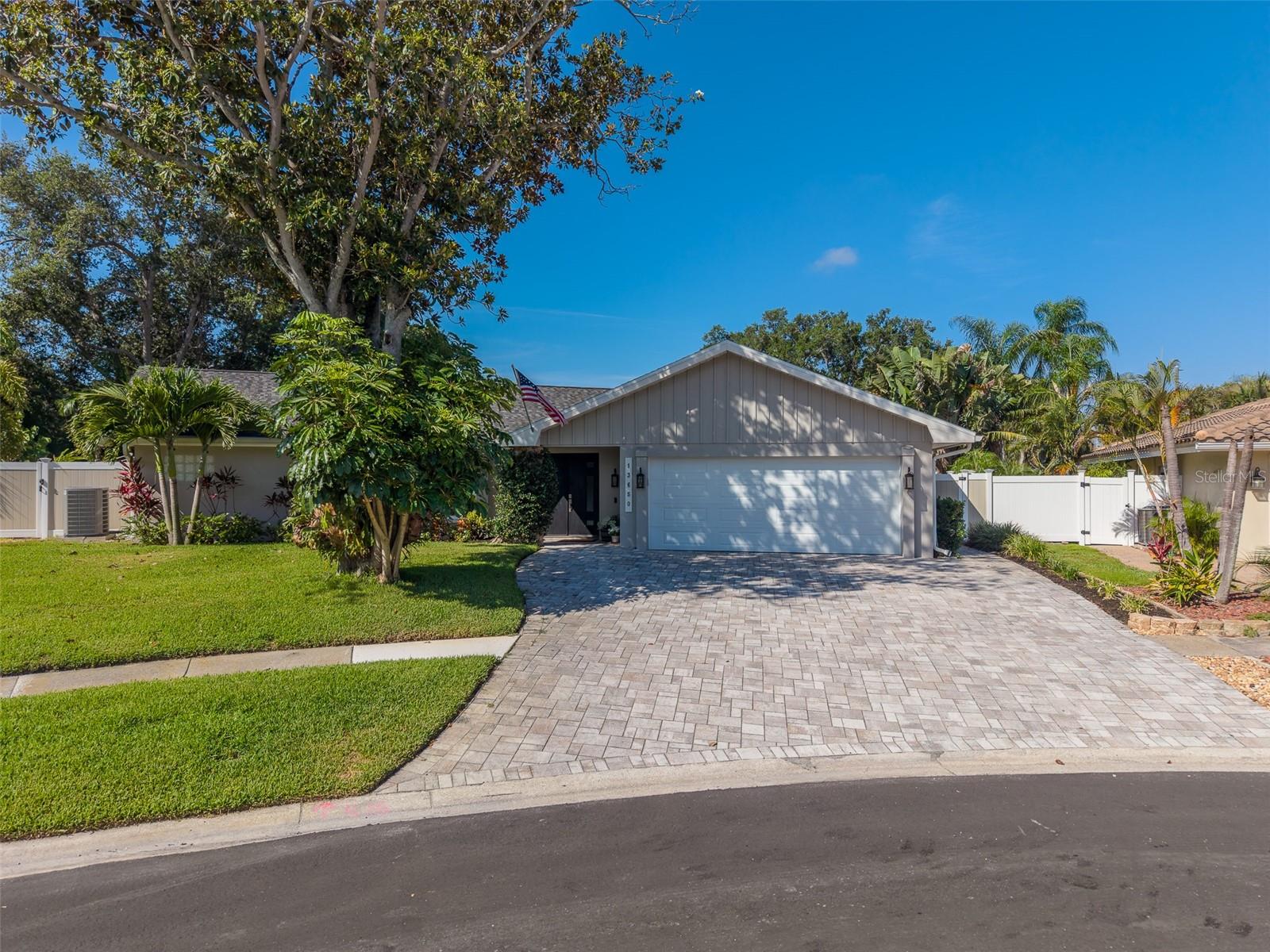 Experience the best of Florida's indoor-outdoor lifestyle in this beautifully updated 3-bedroom, 2.5-bath pool home with an oversized 2-car garage. Nearly every room opens to the home's true showpiece—an extraordinary 1,700-square-foot screened lanai surrounding a sparkling PebbleTec saltwater pool, creating the perfect setting for entertaining or relaxing year-round. A charming koi pond adds a peaceful, one-of-a-kind touch.
Ideally located just minutes from the beaches but no flood zone here at approximately 60 feet above sea level, this home offers both peace of mind and an impressive list of recent upgrades. Major improvements include a new shingle roof (September 2025), hurricane-rated garage door (June 2025), fresh exterior paint (2022), and a newer paver driveway (2021).
Inside, thoughtful updates continue throughout. The beautifully remodeled bathrooms (2020), laminate flooring, whole-house water filtration system, water softener, and new water heater (2022) provide modern comfort and convenience. The open kitchen is designed for both everyday living and entertaining, featuring wood cabinetry, quartz countertops, a large farmhouse sink, stainless steel appliances, and expansive windows that open directly to the pool and lanai. 
PGT impact windows and three sets of impact sliding glass doors, combined with the brand-new roof, provide added security and confidence during Florida's storm season. Tubular skylights bathe the home in natural light, while a cozy wood-burning fireplace creates a warm and inviting gathering space.
The spacious guest bedroom offers exceptional flexibility with its own private entrance and kitchenette, making it ideal as a guest suite, in-law quarters, teen retreat, home office, or potential income-producing space.
Whether you're searching for a primary residence, seasonal getaway, or investment property, this versatile home checks every box. With resort-style outdoor living, a private guest suite, and a prime location just minutes from the Gulf beaches, it offers outstanding appeal.