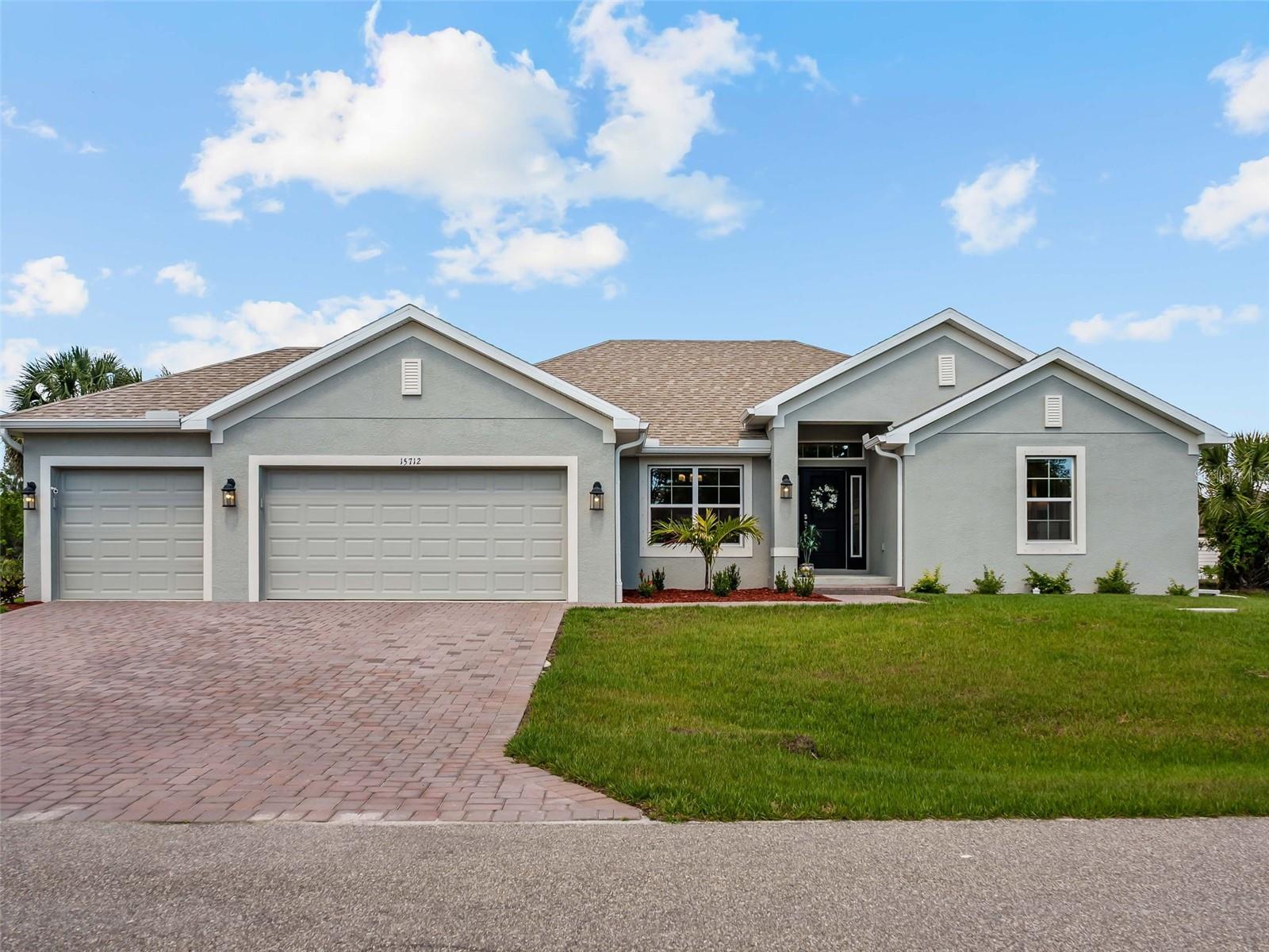 Built in 2025, this 4 bedroom, 3 bathroom South Gulf Cove home sits on 80 feet of Red Hook Waterway frontage with direct lock access. One bridge to clear and you're at the SGC lock, then the Myakka River, Charlotte Harbor, and the Gulf. Your boat isn't waiting on a dream. It's waiting on you.

Step inside and the open feel hits immediately. Ceramic plank tile runs through the entire home. The kitchen earns attention with quartz countertops, upgraded cabinetry, and stainless steel appliances. This isn't a starter finish package. The primary suite has a step ceiling, walk-in closet, and a spa-style en suite with a 5-foot tiled shower. Two more full bathrooms serve the remaining three bedrooms with the same quality throughout.

Slide open the doors of your pocket slider. Your 24x10 screened and covered patio looks straight out at 80 feet of saltwater canal. That view doesn't get old.

Outside: paver driveway, Bahia sod with irrigation, and a 3 car garage on a 10,000 square foot lot. South Gulf Cove has a community boat ramp and a voluntary HOA at just $120 a year.

This one comes fully furnished. Every piece of furniture, all appliances, both 2 TVs, the garage workbench, and the storage rack all convey. You're not starting from scratch. You're just moving in.

Turnkey waterfront homes with direct lock access at this price point don't sit long.