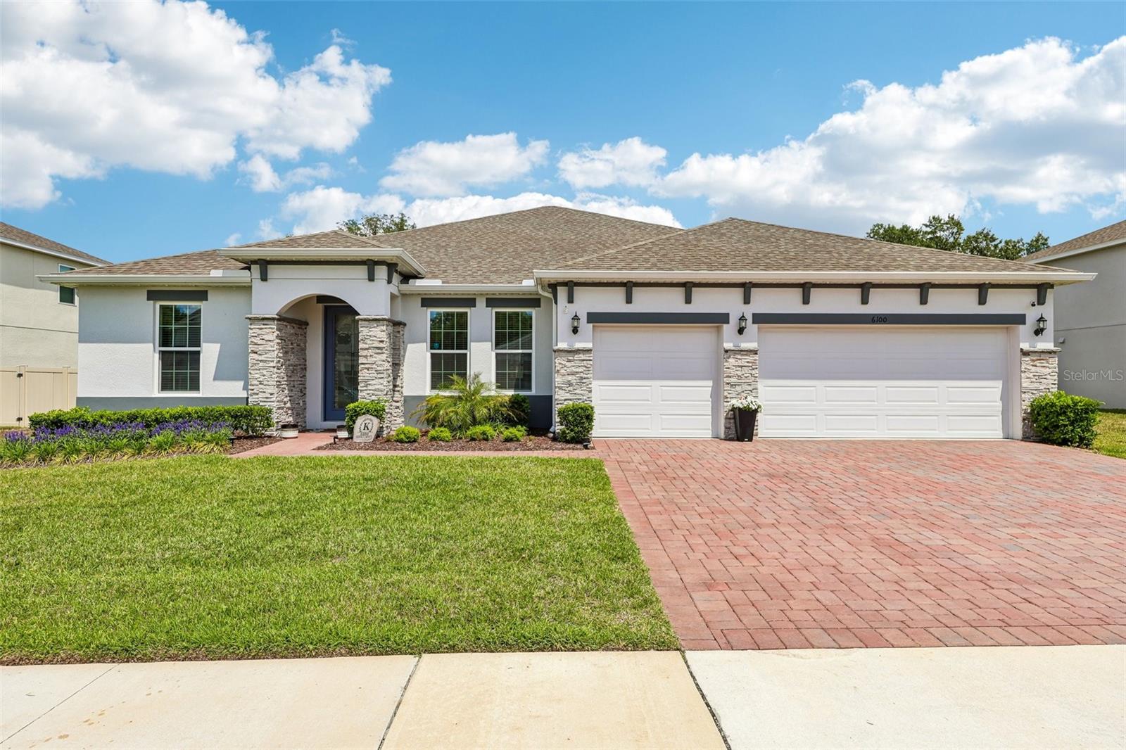 PRICE IMPROVEMENT!!! Welcome to a home that truly checks every box – and then goes a step further! BUILT IN 2024 and thoughtfully UPGRADED THROUGHOUT (over 90k in upgrades!), this MOVE-IN READY 4-bedroom +office, 3-full bath home in the desirable Mount Dora community of Bargrove Estates offers the feel of brand-new construction without the wait. Positioned on an oversized .35 ACRE LOT, fully fenced with no immediate rear neighbors, this property delivers both space and privacy. You will appreciate recent enhancements that include: sealed front and rear pavers (including the front stonework), exterior Govee lighting, and a backyard transformation into a true entertainer’s paradise – complete with a HOT TUB, FIRE PIT, and dedicated LOUNGE AREA designed for relaxing or hosting year-round. Not to be outdone, the interior delivers a bright, flowing layout anchored by a CHEF’S GOURMET KITCHEN that truly serves as the heart of the home. A massive QUARTZ ISLAND with bar seating sits beneath designer PENDANT LIGHTING, while STAINLESS STEEL APPLIANCES – including a GAS RANGE – pair perfectly with the stylish herringbone tile backsplash. A walk-in pantry adds to the functionality, and the kitchen seamlessly connects to the dining area and spacious family room. Oversized sliding glass doors extend the living space outdoors to the COVERED & EXTENDED LANAI, creating effortless INDOOR/OUTDOOR LIVING. This single-story floor plan features spacious bedrooms, upgraded bathrooms, a dedicated office/flex space, and a versatile formal/bonus room. The SPLIT BEDROOM layout provides ideal separation, with your PRIMARY SUITE tucked into its own private wing – offering a generous bedroom, beautifully finished en-suite bath with a dual sink vanity, soaking tub, and separate shower, plus an expansive WALK-IN CLOSET. Secondary bedrooms and bonus living spaces are located on the opposite side of the home, along with two additional full baths – including one at the back with direct access to the lanai. Additional highlights include LUXURY VINYL PLANK FLOORING throughout the main living areas, a 3-CAR GARAGE with epoxy flooring and abundant storage, a whole-home WATER SOFTENER/FILTRATION SYSTEM, tankless water heater, and an EV CHARGER already in place. Residents will love the open green space of the community park and the welcoming neighborhood feel – all with a low HOA. Conveniently located with easy access to US-441, the 429, and Lake Apopka, you are just minutes from shopping, dining, and outdoor recreation. Spend weekends exploring historic downtown Mount Dora, head north toward The Villages, or enjoy quick access south to Central Florida’s world-famous attractions. A quiet, tranquil setting with everyday convenience – this is the one you have been waiting for. Bargrove Estates welcomes you HOME - call today to schedule your tour!