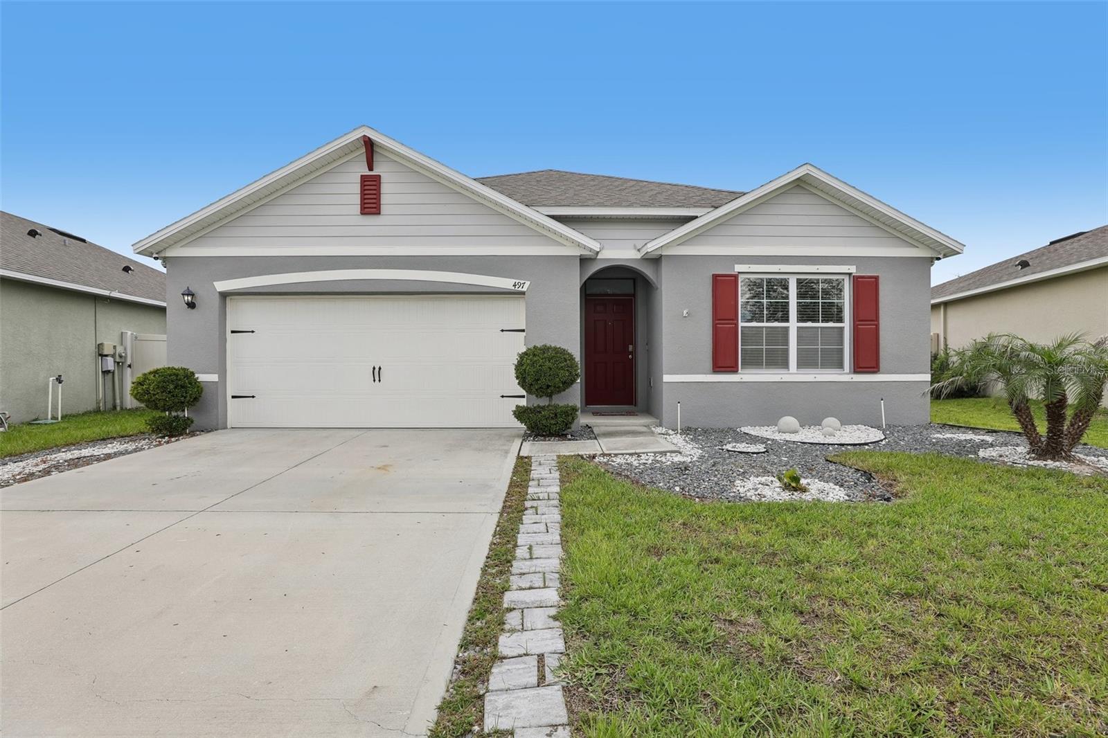Welcome home to this beautifully maintained 2020-built 4-bedroom, 2-bath residence in Davenport's desirable Charles Cove community. An open-concept layout welcomes you with tile flooring flowing through the main living spaces and a well-appointed kitchen featuring crisp white cabinetry, a spacious center island, granite counters, and stainless steel appliances. The primary suite features a dual-sink vanity, walk-in shower, and generous walk-in closet. Step outside to a screened, paver-brick lanai overlooking a fully fenced backyard bordered by open green space and natural ponds — perfect for relaxing or entertaining. Charles Cove offers a resort-style community pool, clubhouse, playground, and scenic walking trails, plus quick access to US-27 and I-4 that puts Posner Park's shops, dining, and movie theater, ChampionsGate's restaurants and golf, and the Reunion golf corridor just minutes away. You're also close to AdventHealth medical care, Tom Fellows Community Center with its gyms and fitness center, the new Polk State College campus opening Fall 2026, and easy reach of the Haines City/Disney-Orlando attractions corridor. Don't miss this move-in-ready gem in one of Davenport's most sought-after communities
