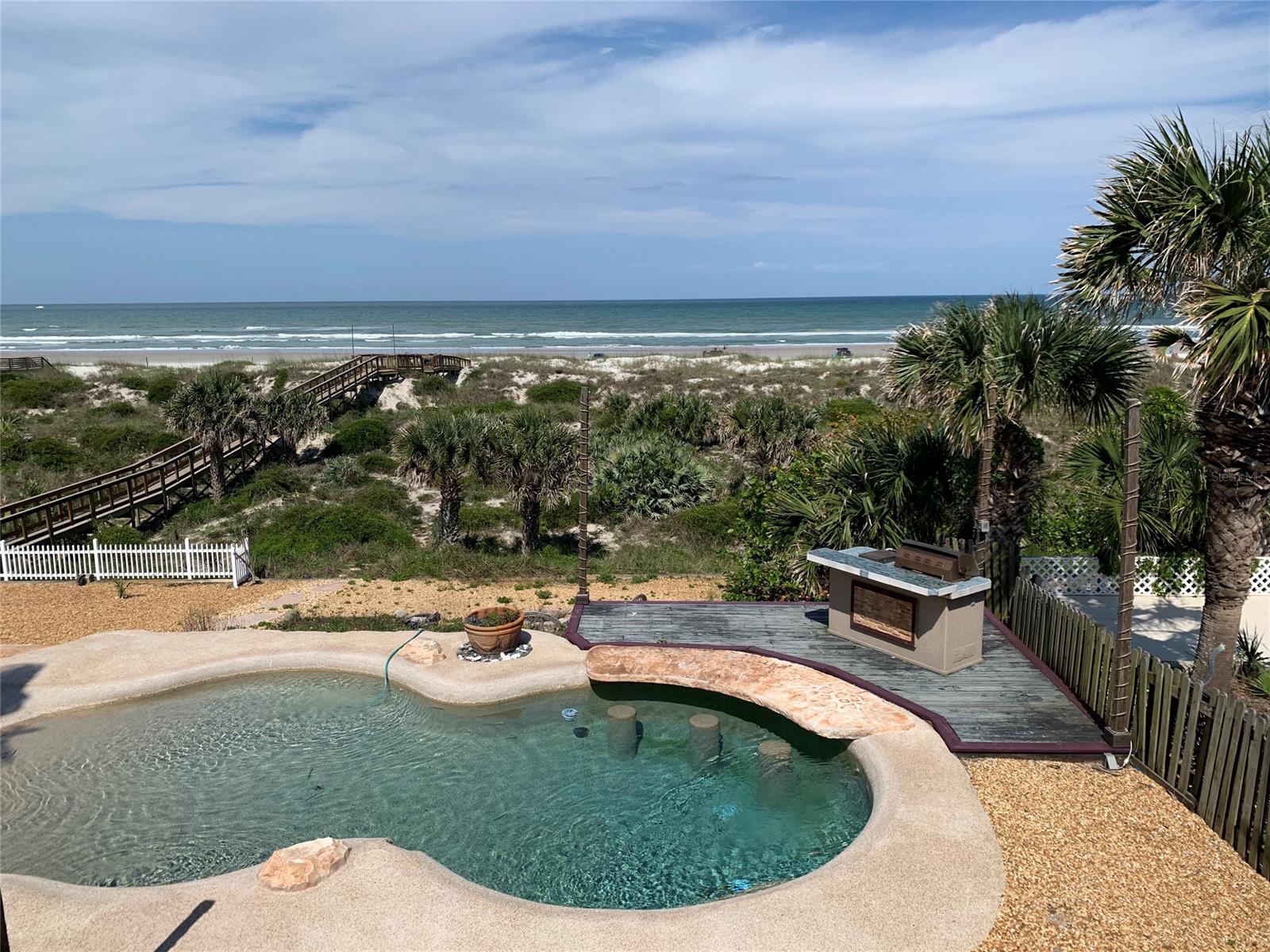Rare ocean front property in coveted New Smyrna Beach neighborhood!
NEW ROOF to be installed by sellers - Permits and Plans in place for interior renovations!

This opportunity will not last. Now is the time to purchase this rare ocean front property on New Smyrna's coveted "North Beach" and have your own piece of the NSB coastline. One of the best features of this property is the beach front pool which overlooks the dunes at a +20 ft elevation. Sit back on your patio or enjoy a cocktail in your pool and watch the waves roll in. 

The current home is made up of 3 bedrooms and 2 baths with 2,428 SF of living space. The renovation plans include an additional bathroom and a half bath, open concept kitchen, large master suite, and laundry room as well as the addition of a bedroom on the first floor making the home a 4 bed 3.5 bath beachside dream home. 

Some of the principals in this transaction are licensed real estate agents, including those at the Kern Company. All permits and plans are included in the purchase price.

The home is being sold AS IS with permits and fully approved renovation plans. This is the chance to add your own flair and style to this incredible beach front home. Now is the time to purchase this property and create the home of your dreams ;Water: City