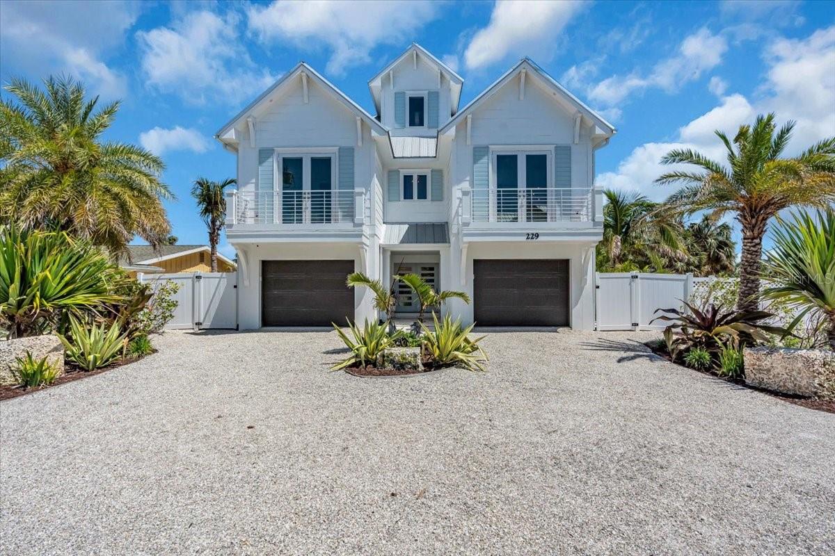 Here is your chance to own a 5 bed/4.5 bath custom waterfront residence on one of the most coveted streets in the City of Anna Maria. Enjoy the rare luxury of having direct boat access in your backyard while just a short walk to the pristine shores of the Gulf. This home offers the best of both waterfront lifestyles. Thoughtfully designed with a modern coastal aesthetic, the home features high-end appliances, custom trim details throughout, and smart home integration for effortless convenience. Each bedroom offers a private en-suite bath.  A custom built-in bunk room maximizes space (sleeping up to 5) with craftsmanship that speaks to intentional design, adding versatility for guests or family.  Privately tucked away on the third floor, you have the expansive primary suite that offers a serene and secluded retreat, featuring a large walk-in shower and soaking tub. Open the sliding glass doors and you are greeted with a generous private balcony that invites quiet moments of relaxation. Anchored by an oversized island, the kitchen is a chef and entertainer’s dream, featuring a gas range by Wolf, a Sub-Zero refrigerator, and a 24-bottle wine fridge. The main living level balcony is outfitted with built-in outdoor cabinetry and a premium ceramic grill, creating a fully functional alfresco cooking space just steps from the kitchen. The kitchen is the centerpiece of this well-designed floor plan that allows for the living and dining spaces to come together effortlessly. Built-in storage in the living room offers seamless organization without disrupting the clean aesthetic, while a dedicated coffee bar adds a touch of everyday luxury and convenience. Another major convenience is the elevator that gives you access to all levels of the home. These subtle yet meaningful touches are found throughout the home, reflecting a level of care and quality rarely seen. On the ground level you have a beautifully constructed cabana space that blurs the line between indoors and out, overlooking a meticulously turfed lawn and an expansive pebble finish pool that shimmers like cut glass. On rainy days, the pool cabana offers a theater like movie experience equipped with a large tv that includes a Sonos surround system and plenty of space for indoor gaming. Lime rock landscape adds geological gravitas, while an outdoor shower and a tucked-away kayak rack offer an unexpected delight. For the nautical connoisseur, the composite dock with an elevator lift provides open-water access with ease. The garage offers ample space for 2 cars, a golf cart, and all your beach toys. This meticulously maintained home has never been a vacation rental, but this could be a wonderful investment property that allows for short-term stays. Come schedule your private showing today!