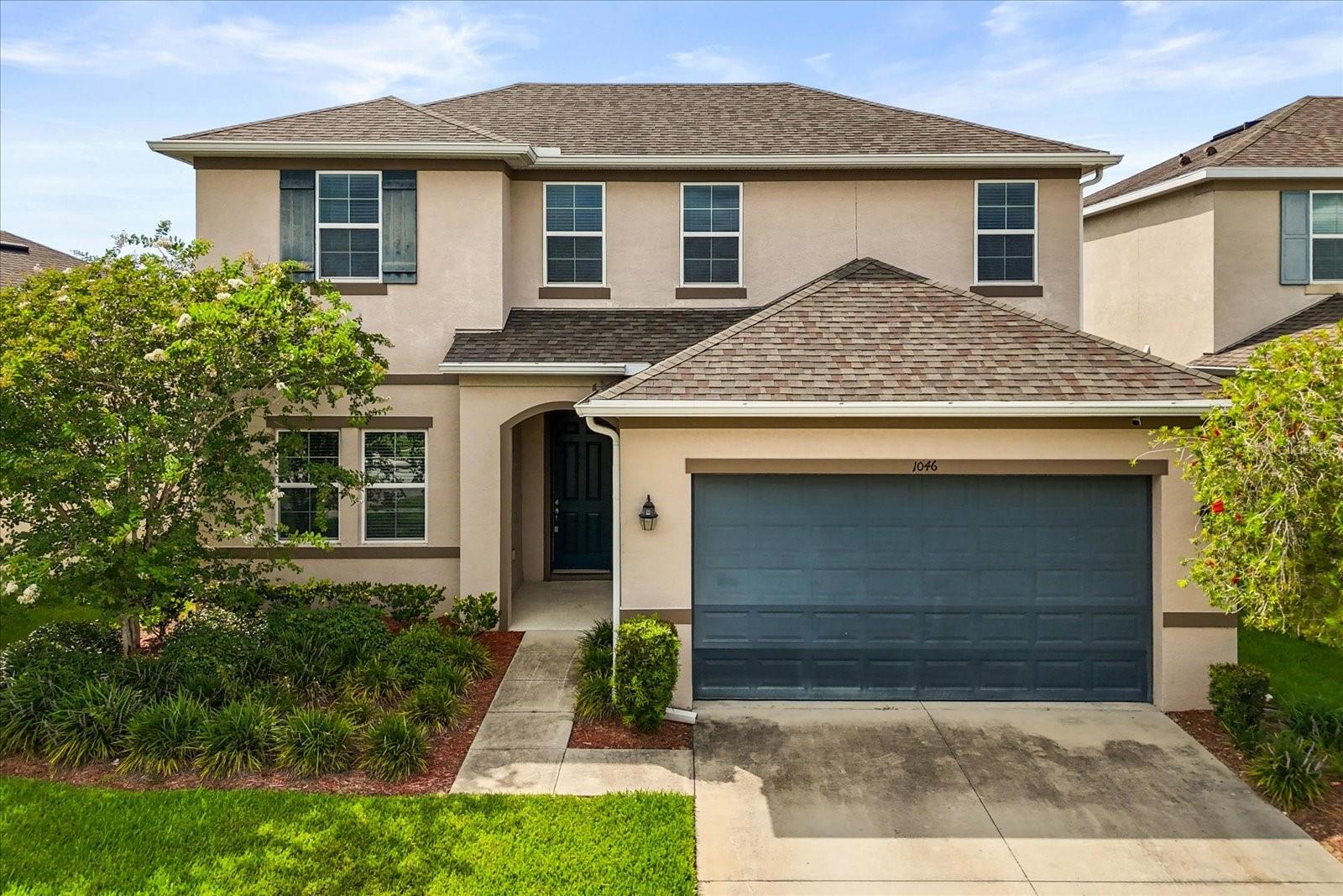 Welcome to 1046 Grand Hilltop Drive, a beautifully maintained 5-bedroom, 3-bathroom residence located in the desirable Hilltop Reserve community of West Apopka. Built in 2018 by K. Hovnanian, this thoughtfully designed home combines modern style, functional living, and everyday comfort in a prime Central Florida location with convenient access to FL-414 and FL-429.

Step inside to discover a spacious and inviting open-concept layout designed for both entertaining and daily living. The bright living and dining areas feature soaring ceilings and elegant tile flooring, creating an airy and welcoming atmosphere throughout.

The gourmet kitchen serves as the heart of the home, showcasing granite countertops, a large center island, ceramic tile backsplash, stainless steel appliances, a gas range, and upgraded 42-inch cabinetry—perfect for preparing meals, gathering with family, or hosting guests.

A first-floor bedroom and full bathroom offer exceptional flexibility, ideal for guests, multigenerational living, or a private home office setup.

Retreat to the spacious primary suite located on the main level, featuring a custom walk-in closet, convenient laundry room access, and a spa-inspired en-suite bath complete with dual vanities and a glass-enclosed shower.

Upstairs, a generous loft provides additional living space that can easily serve as a media room, playroom, fitness area, or home workspace, complemented by three additional bedrooms and a full bath.

Enjoy Florida living year-round in the screened lanai overlooking a fully fenced backyard with no rear neighbors, offering added privacy and the perfect setting for outdoor dining, entertaining, or relaxing evenings at home.

Residents of Hilltop Reserve enjoy resort-style community amenities including a sparkling pool, cabana, and playground, all while being close to shopping, dining, schools, and major commuter routes. This move-in ready home offers the perfect balance of space, convenience, and modern living.