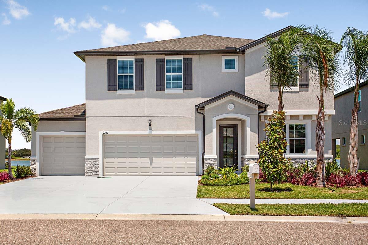 Dreaming of a new home with a water view which does NOT require flood insurance. This beautiful, move-in-ready Juniper home is the one to see! From the moment you arrive, this home will wow you with stunning views of the lake from the family room, kitchen, and owner’s suite. Not only do you have tranquil lake vistas, but you also have impact glass throughout, so you never have to worry about installing/removing hurricane shutters. This amazing home also features a three-car garage and a huge family room with abundant natural light. On the second floor, you have a privat e, spacious owner’s suite with a large loft area, plus three additional bedrooms and three full baths. This home is loaded with upgrades and is truly a must-see! Builder is offering up to $5000 in PAID closing cost incentives with use of Preferred Lender and  closed by year end 2023.   All room sizes are approximate.
