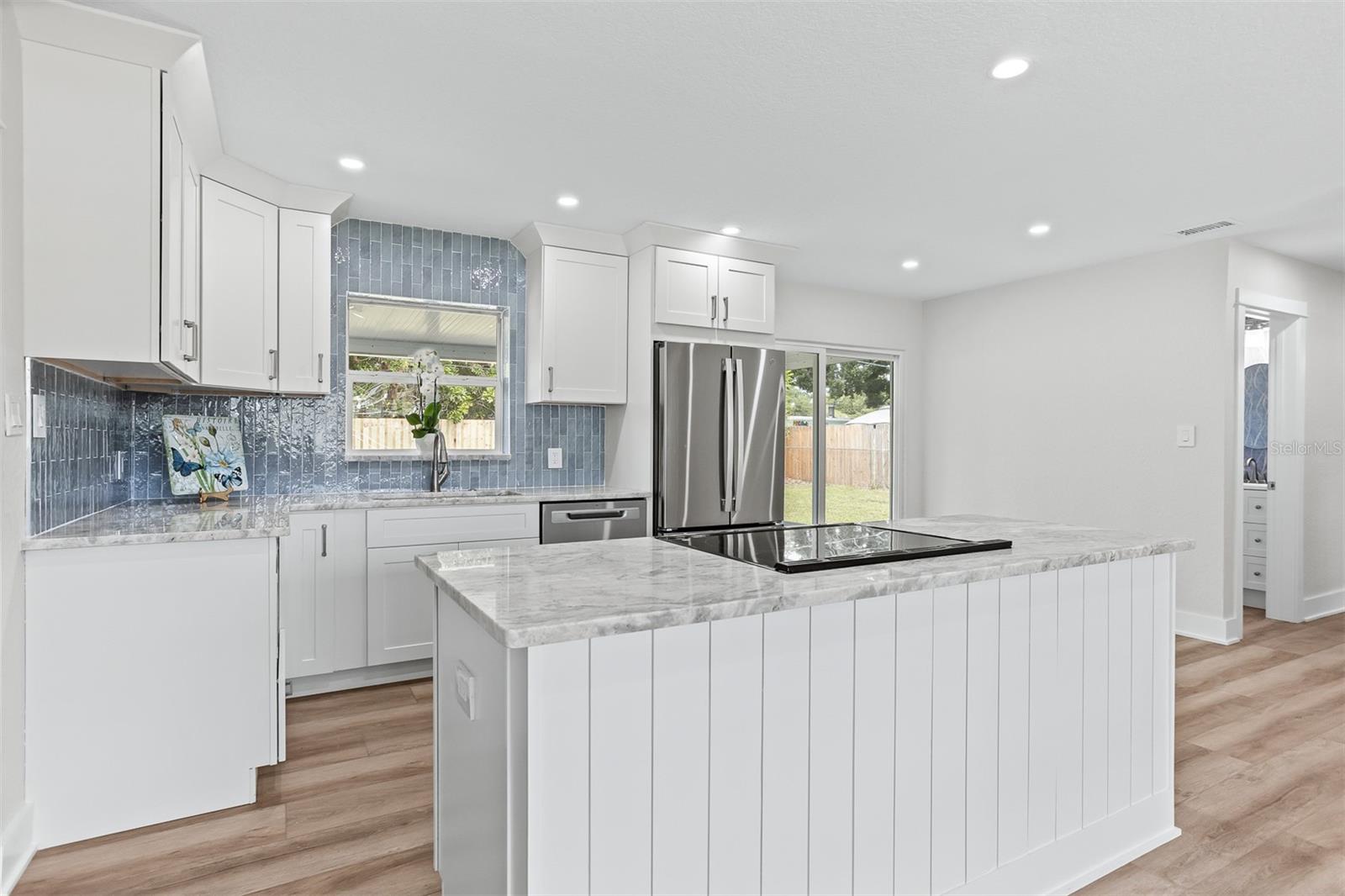 This beautifully renovated home in the heart of St. Petersburg and Pinellas County is truly move-in ready. Offering 2 bedrooms and 2 bathrooms, this home has been thoughtfully updated throughout with quality finishes, including a beautifully renovated kitchen and bathrooms, new flooring, energy-efficient Pella windows, and classic plantation shutters. Designed to maximize both space and natural light, the open-concept floor plan creates a bright, inviting atmosphere. The stunning kitchen features granite countertops, a large center island, designer tile backsplash, and flows seamlessly into the spacious living area, just perfect for everyday living and entertaining.
The oversized primary suite offers exceptional flexibility, with ample room for a home office, reading nook, or sitting area. Outside, the fully fenced backyard provides plenty of space for pets, play, family gatherings, and even the addition of a future pool. Ideally located just minutes from the Pinellas Trail, Walter Fuller Recreation Complex, shopping and dining in the Tyrone District, award-winning Gulf beaches, and the vibrant restaurants, museums, and nightlife of downtown St. Petersburg, this home offers the perfect blend of comfort, style, and convenience. With nothing left to do but move in, this exceptional home is ready for its next owner. Schedule your private showing today—you won't want to miss this opportunity!