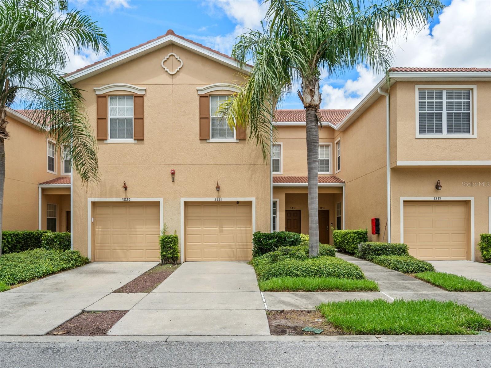 This is an unfurnished 3 bedroom, 2.5 bathroom townhome with a den/office located in the gated Parkridge Circle community! This freshly painted two-story townhome offers an open, split-bedroom floor plan and a 1-car attached garage. The first floor features luxury vinyl plank flooring throughout the main living areas and high ceilings. The kitchen features solid wood cherry-toned raised-panel cabinets, solid surface countertops, stainless steel appliances, and a closet pantry. A pass-through breakfast bar overlooks the living room, and an archway leads to a dedicated dining nook with corner windows. There is a reverse osmosis system under the sink with new filters provided annually. The living room is spacious with sliding glass doors that open to the screened lanai, which looks out onto a private, walled backyard. There is also a half-bath with a pedestal sink on the first floor. Upstairs, the bedrooms and den have new carpet. The master bedroom includes a walk-in closet and an ensuite bathroom. The master bathroom has split vanities with dark wood cabinetry and a tiled walk-in shower. The two spare bedrooms are situated for privacy and share a guest bathroom with a tub/shower combination. The den/office is a versatile space that can also serve as a playroom. A laundry closet with a full-size washer and dryer is conveniently located on the second floor and the 1-car garage includes a built-in overhead storage platform. The home also includes a water softener system and tenant is responsible for adding the salt. Parkridge is a gated condominium community. Its amenities include a heated resort-style swimming pool with a cabana and sun deck, community lakes with decorative fountains, and professionally maintained grounds with tropical landscaping. The property is located off University Parkway, positioned between downtown Sarasota and the University Town Center district. The Mall at UTC, featuring over 100 retailers and numerous dining options, is a short drive east along University Parkway near the I-75 interchange. Nathan Benderson Park, a 600-acre recreational park, is also nearby. Downtown Sarasota, Lakewood Ranch, the Sarasota Bradenton International Airport, and the Gulf beaches are all within easy reach. We score every application. If an application doesn't score high enough, the resident may be required to place the equivalent of two months' rent in a security deposit. Please be aware that leasing this property includes a non-optional Home Assistant Services Package that will cost an additional $39 per month. These services and their cost are separate from Tenant's monthly rent payment and all other payments described in the Lease or any separate Lease addendums. The Home Assistant Services offered are described in the Resident Welcome Packet which can be viewed on website at Sarasota Management.