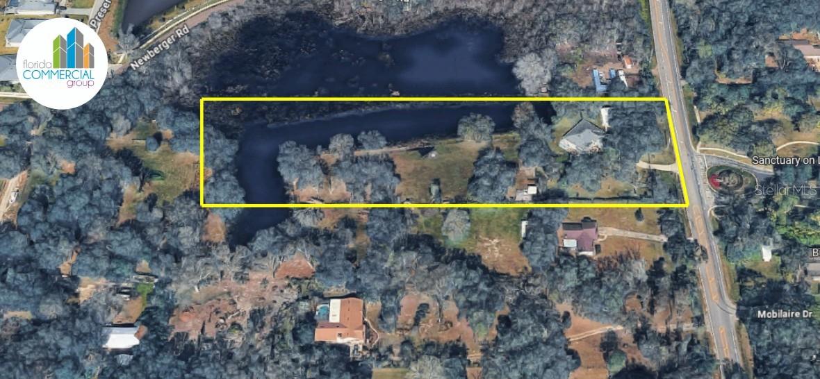 Rare opportunity to acquire a gated 4.83-acre waterfront estate in the highly desirable Lutz/North Tampa corridor. Situated on Livingston Avenue, this unique property features a well-maintained 4-bedroom, 2-bath residence with 1,825 SF of living area, private lake frontage, mature trees, open green space, and exceptional privacy.

Zoned ASC-1 in unincorporated Hillsborough County, the property offers a blend of immediate residential use and future potential. The site includes approximately 3.83 upland acres and 1.00 acre of lowlands/wetlands, creating a scenic and tranquil setting with direct road frontage and convenient access to Tampa, I-275, Wesley Chapel, healthcare facilities, and major retail corridors.

Additional improvements include a detached metal garage and accessory structures. The property's combination of acreage, waterfront views, gated access, and strategic location presents an exceptional opportunity for owner-users, investors, estate buyers, or those seeking a distinctive lifestyle property. Potential future uses may include agricultural, residential, home-based business, or other specialty uses, subject to Hillsborough County approval and verification by the buyer.

A truly rare offering combining privacy, natural beauty, accessibility, and long-term value potential in one of Tampa Bay's most desirable growth corridors.