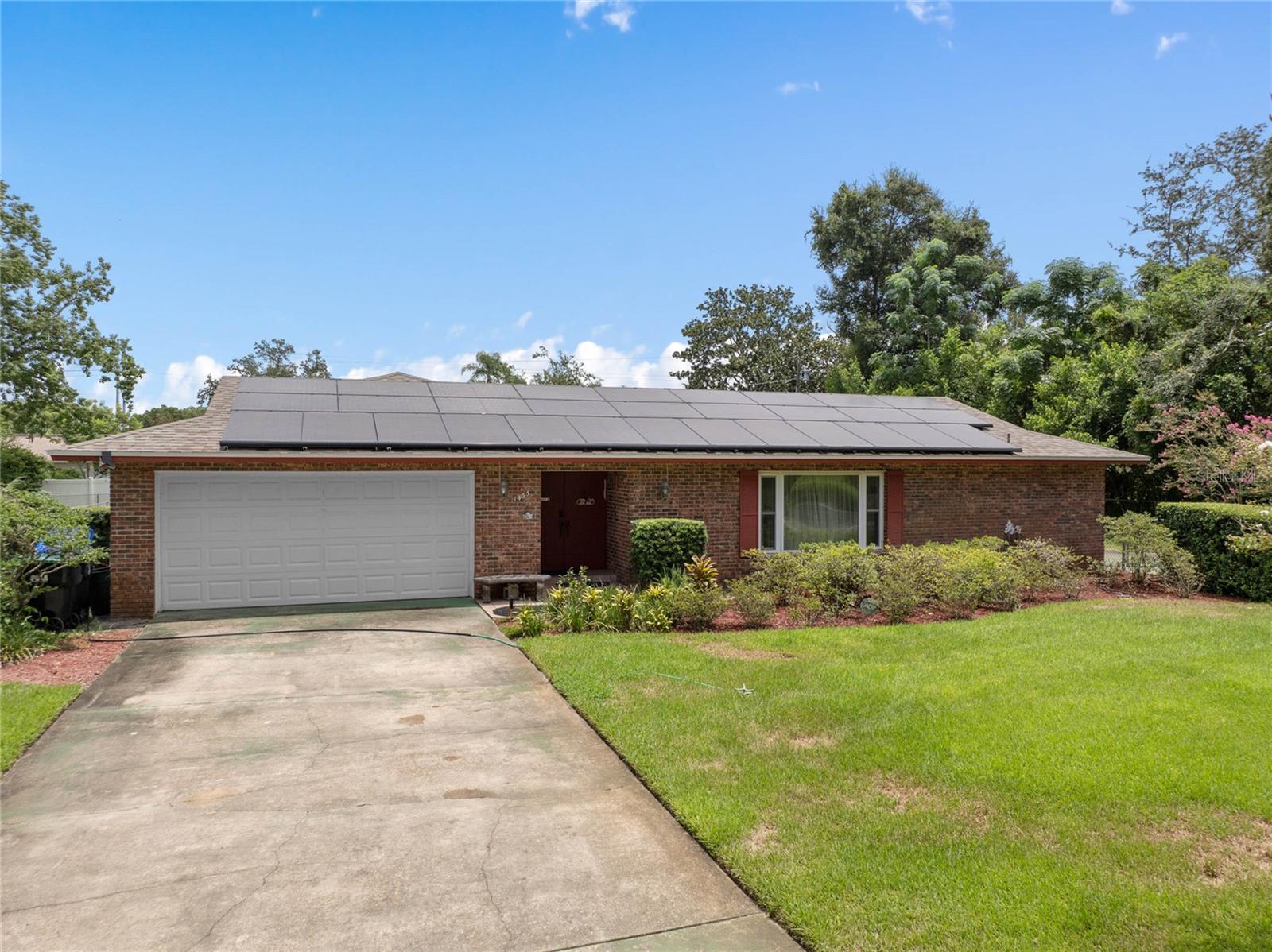 Discover the perfect blend of comfort and outdoor living in this four-bedroom, two-bathroom residence nestled on nearly half an acre in Apopka, Central Florida. The home features a spacious living area, a old fashioned kitchen with modern appliances, and a master suite with an en-suite bathroom, all designed for utmost comfort. Step out onto the air-conditioned back patio where you can sit and enjoy the gorgeous view of the back yard and listen to the sounds of house, finches and songbirds while you read, study, or relax on a giant bean bag set for the perfect view. The expansive yard features lush green grass, a shuffleboard court, and a fire pit where you can host friends and family for a barbecue. Located in a serene yet convenient part of Apopka, this property is close to schools, shopping, and dining, along with being only a half an hour away from Disney and Universal Studios, making it an ideal haven for those seeking a peaceful lifestyle with city amenities within easy reach. A true gem in Central Florida, this home is a must-see for anyone valuing space, privacy, and outdoor living.