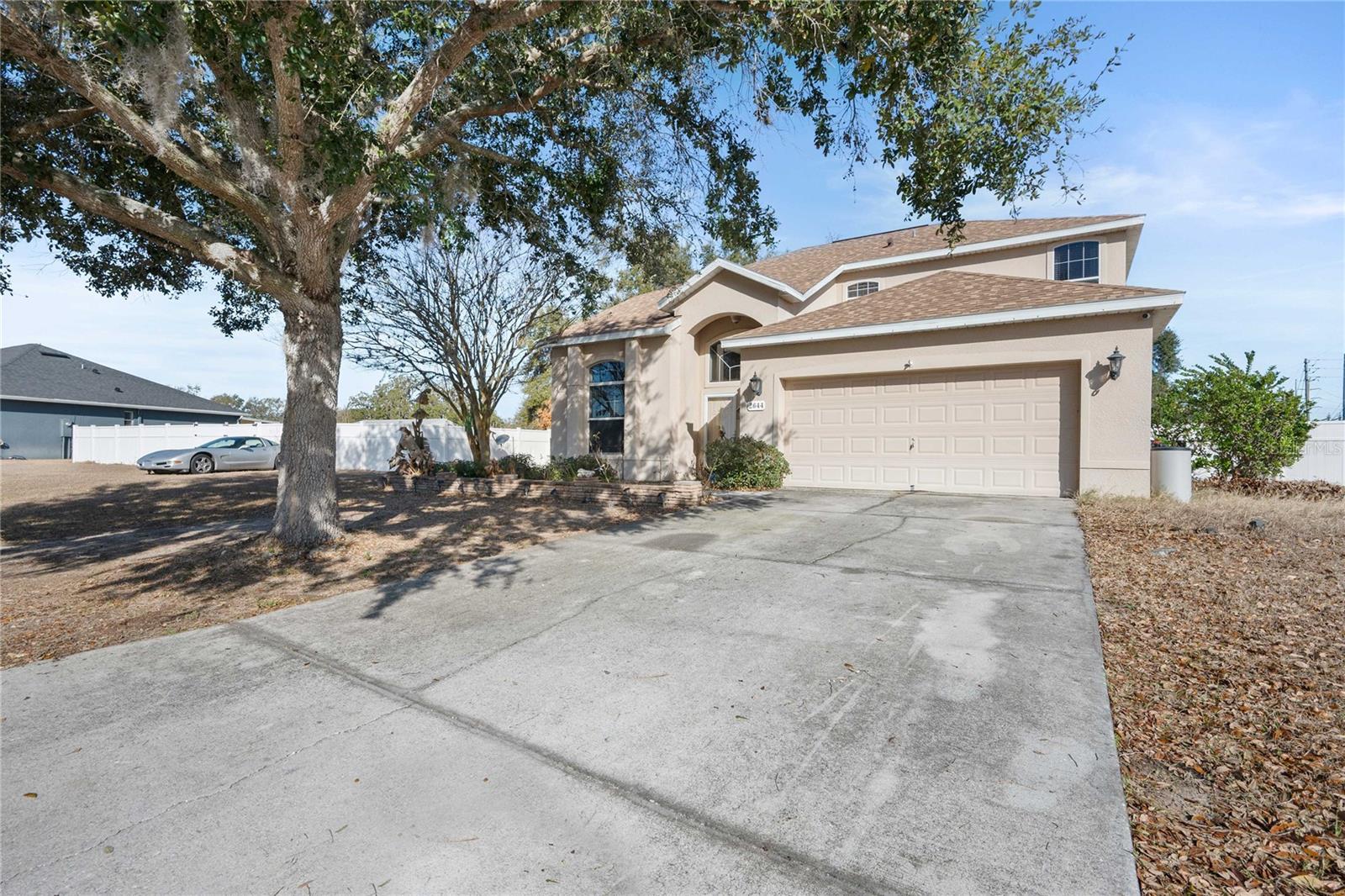 MARKET ADJUSTMENT! 
SELLERS MOTIVATED!
Welcome home to this spacious and versatile two-story gem in the desirable Jumper Creek Manor subdivision of Bushnell!
Built in 2008 and offering an impressive 2,333 square feet of living space on a double lot, this 4-bedroom, 3½-bath home is designed with flexibility and comfort in mind. From the moment you step inside, you’ll appreciate the seamless tile and luxury vinyl plank flooring that flows throughout the home—no carpet to worry about!

The enclosed garage has been thoughtfully converted into a large additional living room, creating the perfect space for entertaining, relaxing, or hosting gatherings. The open floor plan provides plenty of room to spread out, while the layout offers the rare convenience of two master suites—one on the main floor and another upstairs—ideal for multi-generational living or guest privacy.

Upstairs, you’ll find a generous open area that makes a perfect den, media room, playroom, or home office—tailor it to fit your lifestyle!

Step outside and enjoy everything this property has:

Above-ground pool installed in-ground (just needs a new liner to be swim-ready)
Extra screened-in area featuring a hot tub for year-round relaxation
Covered concrete carport with additional backyard parking
Large shed for storage or workshop space
Fenced garden area ready for your homegrown favorites
With a new roof installed just two years ago, major updates are already taken care of. The double lot provides extra breathing room and endless possibilities for outdoor enjoyment.
If you’re looking for space, versatility, and outdoor amenities in a quiet, established community, this property checks all the boxes.