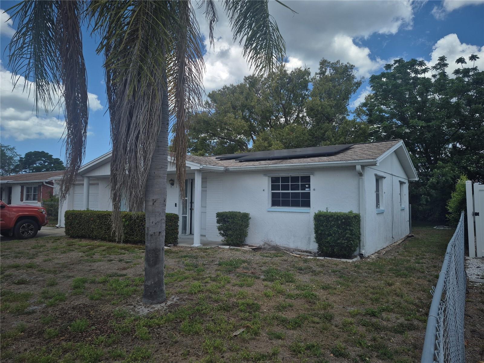 Within minutes from J. Ben Harrill Recreation Complex, Key Vista Nature Park, Coastal Anclote Trail, the Fishing Pier At Anclote Gulf Park, Anclote River Park and MORE, this home offers great potential to Florida Outdoor Lovers! It Needs work but will bring a great return on value as you make the updates that you love. There are new kitchen cabinets on premisis and they need to be installed as the installer passed away mid remodel.  There are various other improvements needed but the home has great potential. A 50 year roof and solar system were installed in 2020 and the solar is owned NOT leased! This home offers long-term value and equity building as it gets the love and care that it needs. It is an excellent opportunity for the right person to fulfill your vision in a very convenient location.