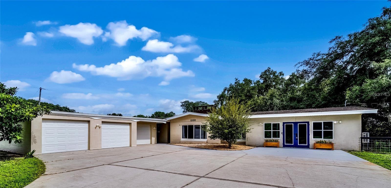 Nestled on 2.4 beautiful fenced acres, this charming 3-bedroom, 2-bath home offers more than 2,400 square feet of living space surrounded by mature trees and peaceful natural beauty. A picturesque pond serves as the centerpiece of the property, creating a serene setting perfect for enjoying Florida's outdoor lifestyle. Inside, you'll find spacious living areas with plenty of room for family gatherings, entertaining, or simply relaxing. The expansive acreage provides endless possibilities for gardening, recreation, animals, or future improvements while still offering privacy and tranquility. Whether you're looking for a country retreat or a place to spread out and enjoy nature, this unique property is a rare opportunity.  Inside, the home features a warm and inviting living room with a fireplace and built-in shelving, plus a second fireplace that opens to the dining area and open-concept kitchen, ideal for entertaining. The kitchen offers abundant cabinetry, granite countertops, a breakfast island, brand-new appliances, and serene views of the backyard. Sliding glass doors lead to a patio perfect for grilling, relaxing, and enjoying Florida’s beautiful weather. The right wing of the home includes three updated bedrooms and two bathrooms filled with natural light. On the opposite side, you’ll find a large laundry room, mudroom, office, and an expansive bonus room with a private exterior entrance—perfect as a game room, studio, guest suite, or fourth bedroom. Schedule your private showing today!