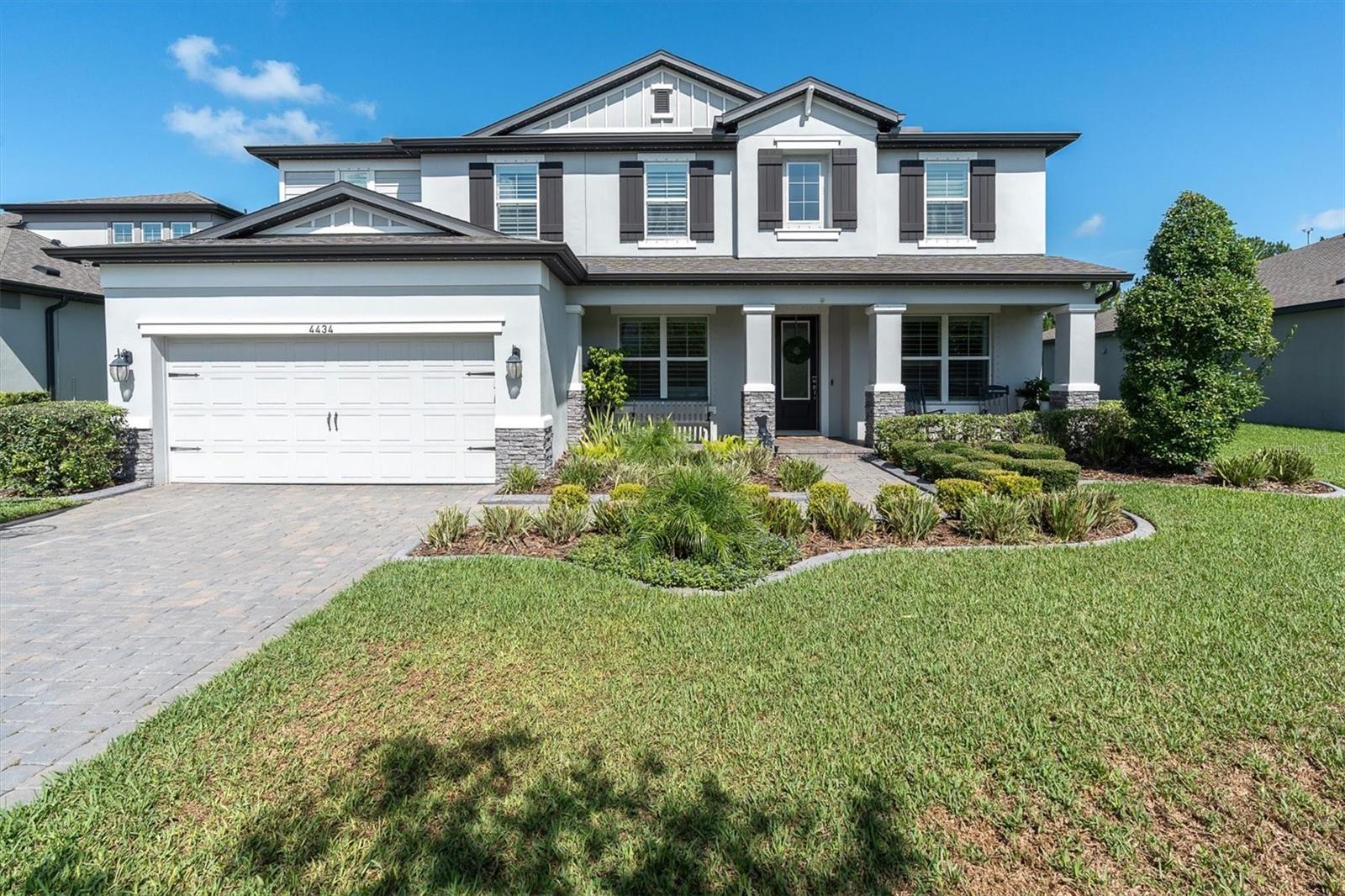 Welcome home to this beautifully upgraded Starkey Ranch pool home, available for rent with July occupancy. Offering 5 bedrooms, 4 bathrooms, a private office, spacious bonus room/loft, and a 3-car tandem garage, this home has the space, layout, and finishes that make everyday living feel elevated.

From the moment you arrive, the curb appeal stands out with a large front porch, manicured landscaping, and a premium pond/conservation homesite with peaceful backyard views. Inside, you are welcomed by natural light, tall ceilings, and an open floor plan designed for both comfortable living and entertaining.  This original homeowner spared no expense adding custom woodwork, window treatments, light fixtures, and high end flooring throughout the home. The enclosed office with French doors provides a great work-from-home space, while the additional front flex room is perfect for a playroom, sitting room, or extra living area. Both front rooms have custom built ins for storage.

The heart of the home is the spacious kitchen, featuring upgraded appliances, abundant cabinetry, a large island, an oversized custom pantry, and beautiful views of the pool and backyard. The kitchen opens seamlessly to the main living area, creating an ideal gathering space with plenty of room to relax or entertain. Downstairs also includes a full bedroom and bathroom with convenient access to the pool area.

Upstairs, the oversized primary suite offers peaceful pond and conservation views, generous natural light, dual walk-in custom closets, and a spacious en-suite bath with dual vanities and a walk-in shower. The second floor also features a large loft/game room, three additional bedrooms, and two full bathrooms, including one bedroom with its own private en-suite bath. The secondary bedrooms offer great closet space, including large walk-in closets.

The backyard is where this home truly shines. Enjoy Florida living with a custom pool, relaxing water features, extended pool deck, and plenty of space for outdoor seating, entertaining, or play — all overlooking a beautiful pond and conservation setting.

Located in the heart of Starkey Ranch, this home is just a short walk, bike ride, or golf cart ride to Starkey Ranch K-8 Magnet School, parks, playgrounds, trails, dog parks, community pools, and all the incredible amenities available in this award-winning community.
