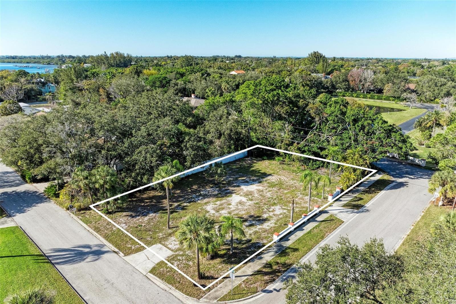 5 MINUTES TO ANNA MARIA ISLAND! Vacant lot ready to build. Low if no impact fees could be a savings of $25,000 to $30,000. 1/ 3 of an acre and will accommodate a home of up to 5,000 square feet with a pool in a very established neighborhood of homes $2,500,000+. No HOA!!! Bring your boat home and park it on the side of your home or in the driveway. Great short time rental opportunities. Your dream home will be 5 minutes from Anna Maria Island but NOT in a high hazard zone so affordable insurance premiums. NO GRAND OAKS to worry about and the lot is cleared, flat and ready for building. The listing agent is also a builder and will work with you to design exactly the home you will love and provide a budget and timeline for your custom dream home.