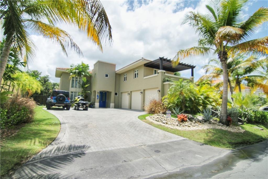 Your best choice in Dorado Beach East. This glamorous home is enveloped in luxurious design, details and finishes. A gorgeous 2 story Villa Carbia 2006 in the best location. Features 4 bedrooms on the second floor with 4 bathrooms, a “casita” (guest house) on the first floor with kitchenet and bathroom, large living, dining room, open kitchen to the family room, triple car garage, pool, covered terrace with wet bar, very private lot with lush landscaping, a tropical oasis ideal for relaxation and entertaining. Additional features are: all the Appliances included and top of the line, A/C split and central, generator, water tank, light fixtures and window treatments. Your best choice in Dorado Beach East.