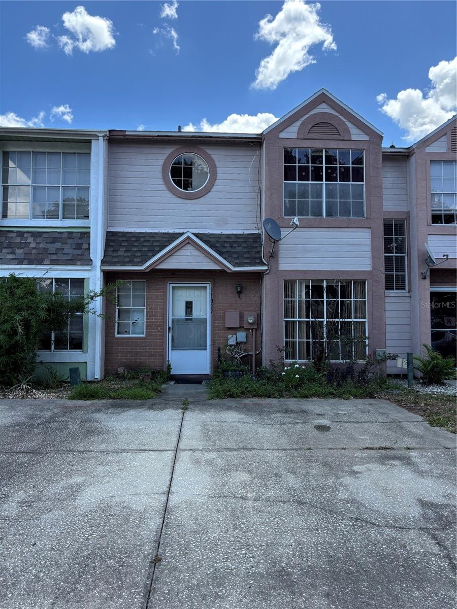 Calling all investors, home flippers, and buyers looking to start or grow their renovation portfolio! 11017 Yorkshire Ridge Court presents an excellent value-add opportunity in one of Orlando's most convenient locations. Whether you're planning your next fix-and-flip or adding another rental property to your portfolio, this 2-bedroom, 2.5-bath townhome offers tremendous potential in an area with strong long-term demand. Enjoy convenient access to Orlando's world-famous attractions, including Walt Disney World, SeaWorld, and ICON Park, along with major roadways, shopping, dining, and Orlando International Airport.

Step inside and imagine the possibilities. The spacious eat-in kitchen is filled with natural light from a large window. The first floor also features a conveniently located laundry closet and half bath. Upstairs, both bedrooms include their own private bathrooms and walk-in closets, providing an ideal layout. Out back, you'll find a screened-in porch overlooking a fully fenced private yard, a great bonus space with plenty of potential.

Located just minutes from SR-417, Florida's Turnpike, shopping, restaurants, schools, and major employment centers, this property is well-positioned for both resale and long-term rental success.

Roof replaced in 2023. Property is being sold AS-IS, WHERE-IS. Cash offers only. Bring your contractor and your vision, this is a true renovation opportunity with significant upside for the right investor. Schedule your showing today!