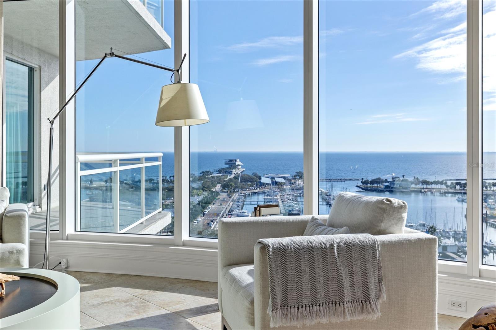 Welcome to the epitome of luxury living downtown. Prepare to be captivated by the breathtaking pier and water views that will leave you in awe. Discover the pinnacle of opulence at Ovation. Indulge in the sophisticated urban boutique waterfront tower, featuring 45 generously-sized residences with unmatched amenities located on the 4th floor, just steps away from the vibrant Beach Drive. Immerse yourself in a world of fine dining, trendy shops, world-class art, and endless entertainment options, all within your reach. As you step into your private elevator, you'll be transported to unit 1402, where the doors open to your elegant foyer entry. Be greeted by the magnificence of water views from every angle. The SE exposure allows for a graceful bath of natural sunlight throughout. In the evenings you’ll be mesmerized by the aerial ambient lights of departing and arriving small aircraft in the distance. This impeccably designed 3-bed, 3.5 bath unit is a true masterpiece with over 3600 sq ft of open concept that effortlessly flows. You'll find the extravagant gourmet kitchen, a chef's dream come true appointed with high end appliances. Grandeur awaits in the primary bedroom, a haven of serenity, with custom closets and floor-to-ceiling windows offering endless water views. The en-suite bathroom is a spa-like sanctuary of relaxation, featuring bespoke marble flooring, a glass walk-in shower, and a separate soaking tub. The two guest suites each offer their own luxurious en-suite and private terraces. The custom-built study/den provides a tranquil space for a home office, library, or even your own yoga retreat. This spacious residence boasts four private terraces providing ample outdoor entertaining space, each offering incredible views. This condo is the personification of contemporary luxury living. Included are two assigned parking spaces that are unobstructed by concrete columns and a climate-controlled storage area with ample space. At Ovation you'll enjoy impressive amenities, including a rooftop heated pool, spa, steam, sauna, fitness center, and 24-hour concierge.
If you prefer a more reclusive and private lifestyle with all that downtown living has to offer then there’s no other choice. Make this prestigious address your address.