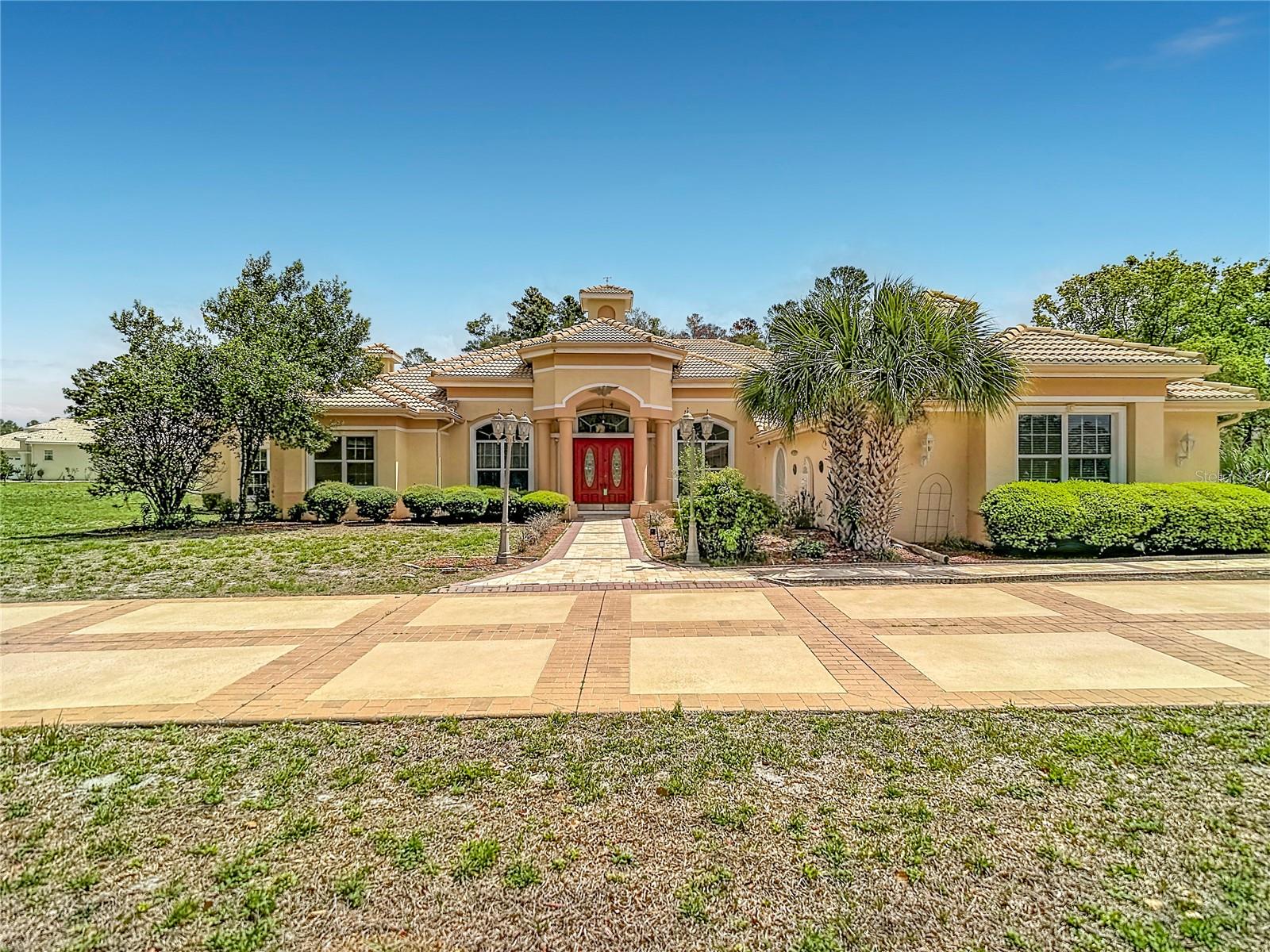 PRICE REDUCTION!    Discover the pinnacle of luxury living in this exquisite 3-bedroom, 3-full-bathroom executive estate pool home nestled on 1.3 acres in the prestigious, deed-restricted Woodland Waters community of Weeki Wachee, FL. Spanning an impressive 5,500 square feet of living space, this Mediterranean-inspired residence offers unparalleled elegance and comfort, highlighted by an attached 3-car garage and a sparkling private pool with spa—perfect for year-round outdoor enjoyment in Florida’s sunny climate.
Step inside through a grand entry featuring stunning marble flooring accented by a custom-designed marble inlay imported from Iran, setting the tone for the home’s sophisticated upgrades throughout. European crystal chandeliers illuminate the formal entry, dining room, and living areas, casting a warm, inviting glow. Multiple gas fireplaces with imported marble sills and ornate, handcrafted wood designs create cozy focal points, while the formal living room boasts an artistic, custom ceiling design that adds dramatic flair. The expansive family room flows seamlessly into the massive master bedroom suite, offering a private retreat, and the lanai provides an ideal space for relaxing or entertaining with serene views of the pool and lush surroundings. A dedicated media room completes the layout, ideal for movie nights or hosting guests in ultimate style.
Woodland Waters is a quiet, family-friendly enclave characterized by rolling hills, towering oaks, and pines that provide a natural, peaceful setting with generous lot sizes and ample breathing room between homes. Residents enjoy exclusive community amenities including a playground, a fishing dock and picnic area on Rooke Lake, and tennis courts—fostering a relaxed, upscale lifestyle on Florida’s Nature Coast.
This prime location places you just minutes from world-famous attractions and destinations within a short drive. Iconic Weeki Wachee Springs State Park, home to legendary live mermaid shows, the Buccaneer Bay spring-fed waterpark with slides and sandy beach, riverboat cruises, and kayaking or paddleboarding along the crystal-clear Weeki Wachee River, lies only a few miles away. Nature enthusiasts will appreciate the expansive Weekiwachee Preserve for hiking, birdwatching, and wildlife viewing, including opportunities to spot manatees, otters, and more. Nearby Pine Island Park offers Gulf of America beach access for swimming, kayaking, and picnics, while Ellie Schiller Homosassa Springs Wildlife State Park (within 20 miles) provides additional opportunities to observe native Florida wildlife up close. The area also boasts scenic trails, golf courses, fresh local seafood dining, and easy access to the broader Nature Coast for boating, fishing, and outdoor adventures—all within a 20-mile radius—delivering the perfect blend of luxurious privacy and endless recreational possibilities.
This rare estate represents sophisticated Florida living at its finest—schedule your private showing today and experience the elegance firsthand.