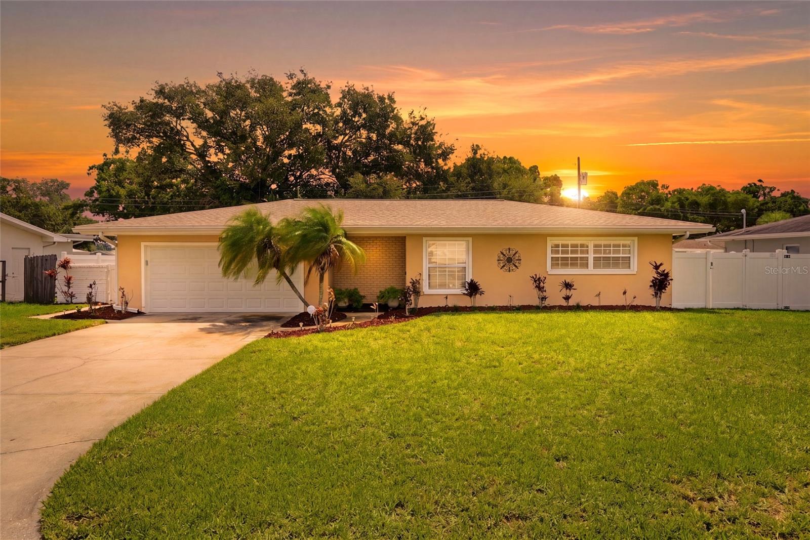 Meticulously maintained and thoughtfully updated, this inviting three bedroom, two bath pool home with an attached two car garage offers comfortable living both inside and out. A bright, split bedroom floor plan welcomes you with abundant natural light and laminate flooring throughout the living areas and bedrooms, with ceramic tile in the kitchen and bathrooms.  Crown molding, found throughout the home except in the bathrooms, adds a refined finishing touch to the living spaces. At the heart of the home, the beautifully updated kitchen features custom designed cabinetry, granite countertops, stainless steel appliances and a timeless subway tile backsplash, creating a stylish and functional space for everyday living and entertaining. The primary bedroom offers a private en suite bath and glass sliders that lead to the pool area. Both bathrooms have been tastefully updated with custom vanities, granite countertops and ceramic tile finishes. Step outside and enjoy your own private backyard retreat. The screen enclosed inground pool is surrounded by expansive decking, providing plenty of space for relaxing or entertaining, while the covered brick paver patio offers a comfortable setting for outdoor dining or enjoying the Florida lifestyle. The spacious 80x110 lot is further enhanced by white vinyl fencing installed in 2017, adding privacy and functionality. For added convenience and peace of mind, the home is equipped with a Ring video doorbell and two exterior security cameras. There is also a Ring security system. Over the last few years, this home has benefited from numerous other thoughtful improvements, including a new shingle roof (2022), HVAC system with Nest thermostat (2019), new ductwork and insulation (2017), water softener (2017) pool enclosure re-screened (2018), new pool pump (2025), new pool sweep (2026), new garage door (2017), new garage door opener (2023) and Nest Protect smoke detectors (2021), Sprinkler system (2022). Ideally located near schools, shopping, local restaurants and within walking distance of Eagle Lake Park, this home combines modern updates, outdoor enjoyment and a convenient location. Come and see this amazing home today and make it yours tomorrow!