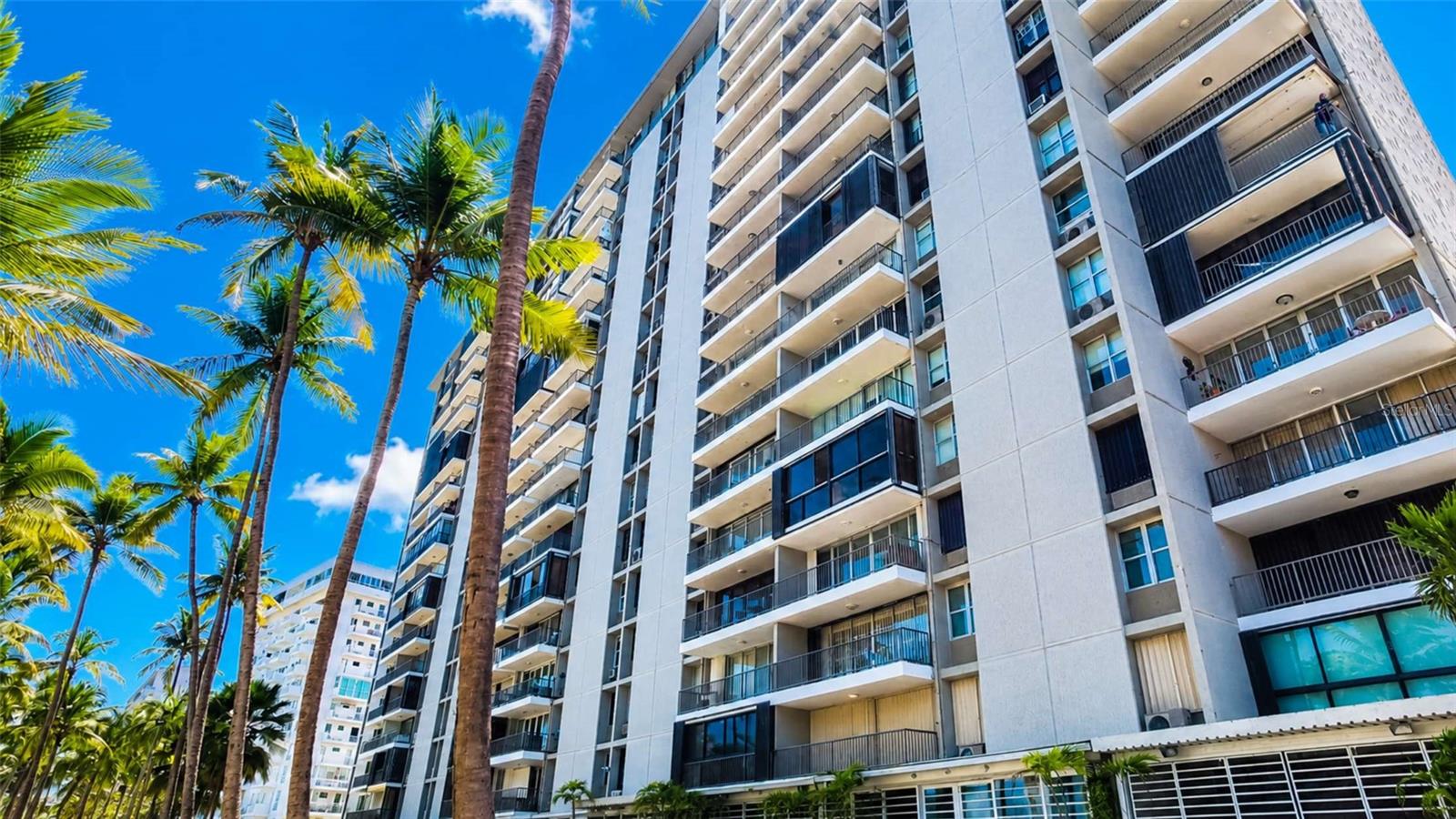 Enjoy beachfront living in this beautifully remodeled and fully furnished 2-bedroom, 2-bathroom oceanfront apartment located in Villas del Mar Este, one of Isla Verde’s most desirable communities.
This 1,042-square-foot residence offers breathtaking ocean views, abundant natural light, and a thoughtfully updated interior designed for comfort and convenience. The open-concept living and dining area flows seamlessly to the balcony, creating the perfect setting to relax and enjoy the coastal lifestyle.
Features include a fully equipped kitchen with all appliances included, tasteful furnishings, washer and dryer, two wall-pack air conditioning units, a split unit in the living room, and one assigned parking space.
Villas del Mar Este offers 24/7 security, direct beach access, swimming pool, fitness center, and beautifully maintained grounds. The community is scheduled to have a full backup generator by August 2026, adding even greater value and peace of mind.
Conveniently located in the heart of Isla Verde, near restaurants, hotels, shopping, entertainment, and Luis Muñoz Marín International Airport.
Short-term rentals are not permitted, making this an excellent opportunity for buyers seeking a primary residence, second home, or long-term investment property.
Offered at $619,000.
Shown only by appointment to buyers with Bank preapproval or proof of funds.