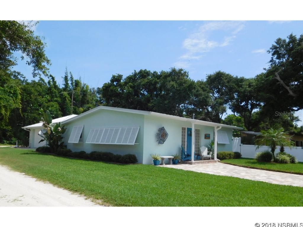 Key West style home tastefully remodeled & only steps to the beach, shops, restaurants & church. Adorable & immaculate, this 3BR/2BA CBS home was totally renovated in 2014 from the metal roof to the wood floors! Attractive private courtyard surrounded by white vinyl fencing is great for BBQ's & get togethers! Gorgeous chefs kitchen with SS appliances, granite counters & tiled backsplash. Lots of new white beaded board cabinets, new oversized composite sink, plumbing & electric fixtures. Attractive pavered driveway & tropical landscaping welcome you to this stunning beachside home! Rear alley access to the double garage provides plenty of parking & storage area for boats, cars, and other toys. Overhead double garage door + golf cart garage door! Both bathrooms have also been beautifully remodeled with gorgeous tiled showers & new vanities. See the sellers disclosure for a list of upgrades in this very special home. Furnished like a model, most are from Southern Trends and are negotiable. ;Water: City