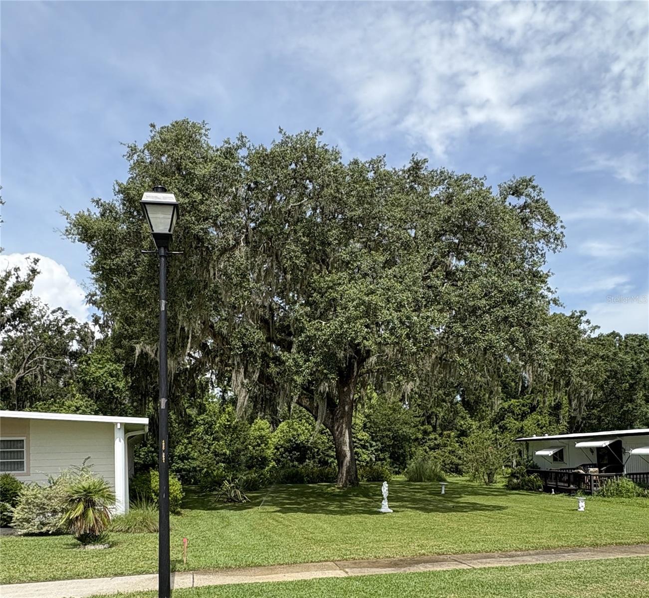 Last Opportunity – Premium Lot Available in This Upscale 55+ RV Resort 
Don’t miss your chance to own the final available lot in one of the area’s most sought-after 55+ RV resorts. Perfectly situated within a meticulously maintained, community, this premium lot offers the ideal blend of tranquility, convenience, and resort-style living. This lot is ready for your setup. You will place a double-wide manufactured home on the lot. Water, sewer, and electric service, cable and internet are available. Whether you’re seeking a seasonal escape or a year-round retreat, this is your exclusive chance to become part of a welcoming and vibrant community. A share of Travers Rest Sock is required. There is no maintenance fee assessed to the property prior to placing the double wide unit on the lot.  Yes, the Grand Oak on the lot must be removed when the double wide is set up.