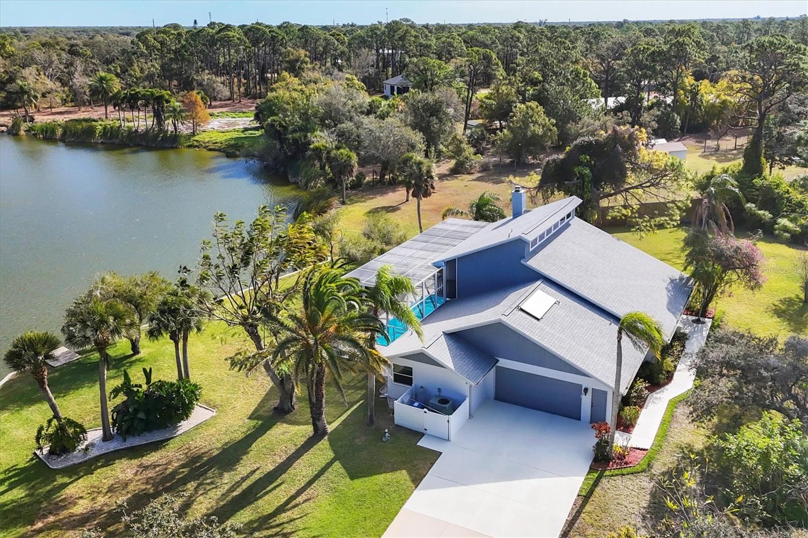 Your Dream Home Awaits — Just One Mile from Manasota Beach
Waterfront-1.23 Acre one-owner Estate. Imagine waking up every day knowing the beach is minutes away and home feels like a private retreat. This elegantly inspired, beautifully built residence is designed to capture your heart from the moment you arrive. A Private Waterfront Escape-Set along a serene private lake, this meticulously crafted pool home offers peace, privacy, and everyday tranquility. With three separate suites, everyone enjoys their own personal sanctuary—perfect for family living or hosting guests in comfort. Storybook Views, Everyday Magic-Wake up to lake views that feel straight out of a fairytale. Pride of ownership shines at every turn, from the winding private driveway to the lush, manicured gardens that frame the home beautifully. Suite Dreams, Elevated-The upper primary suite is a true showstopper—an expansive BONUS retreat featuring sliders that open to a private upper deck with fireplace. It’s ideal for morning coffee, evening sunsets. A second primary suite on the lower level and a private guest suite add flexibility and comfort for any lifestyle. Where Culinary Magic Happens-Calling all chefs! The gourmet kitchen is designed to impress with custom cabinetry, granite countertops, double ovens, a center island, and a spacious breakfast bar. Whether entertaining or enjoying a quiet night in, this kitchen is ready to deliver. Coastal Living at Its Best-Enjoy the best of both worlds—peaceful living without giving up convenience. Located approximately one mile from the Gulf of Mexico, you’ll have easy access to world-class fishing, boating, swimming, sunbathing, and a vibrant coastal lifestyle. Motivated Seller • Easy Closing-the path to closing is smooth. This dream home is ready for its next chapter—and it could be yours.  Ready to experience the heart and soul of this extraordinary property? New 2 story Pool Cage 2026; New Roof 2020, Home painted 2021, Pool Pump replaced 2022; Solar Panel replaced 2022; Septic Pumped 2022; Garage door opener 2023; Central Vac 2023; AC’s 2010 & 2011;  Home has several hurricane sliders, upstairs Bedroom Hurricane windows. Please Schedule your private showing today and let the magic begin.