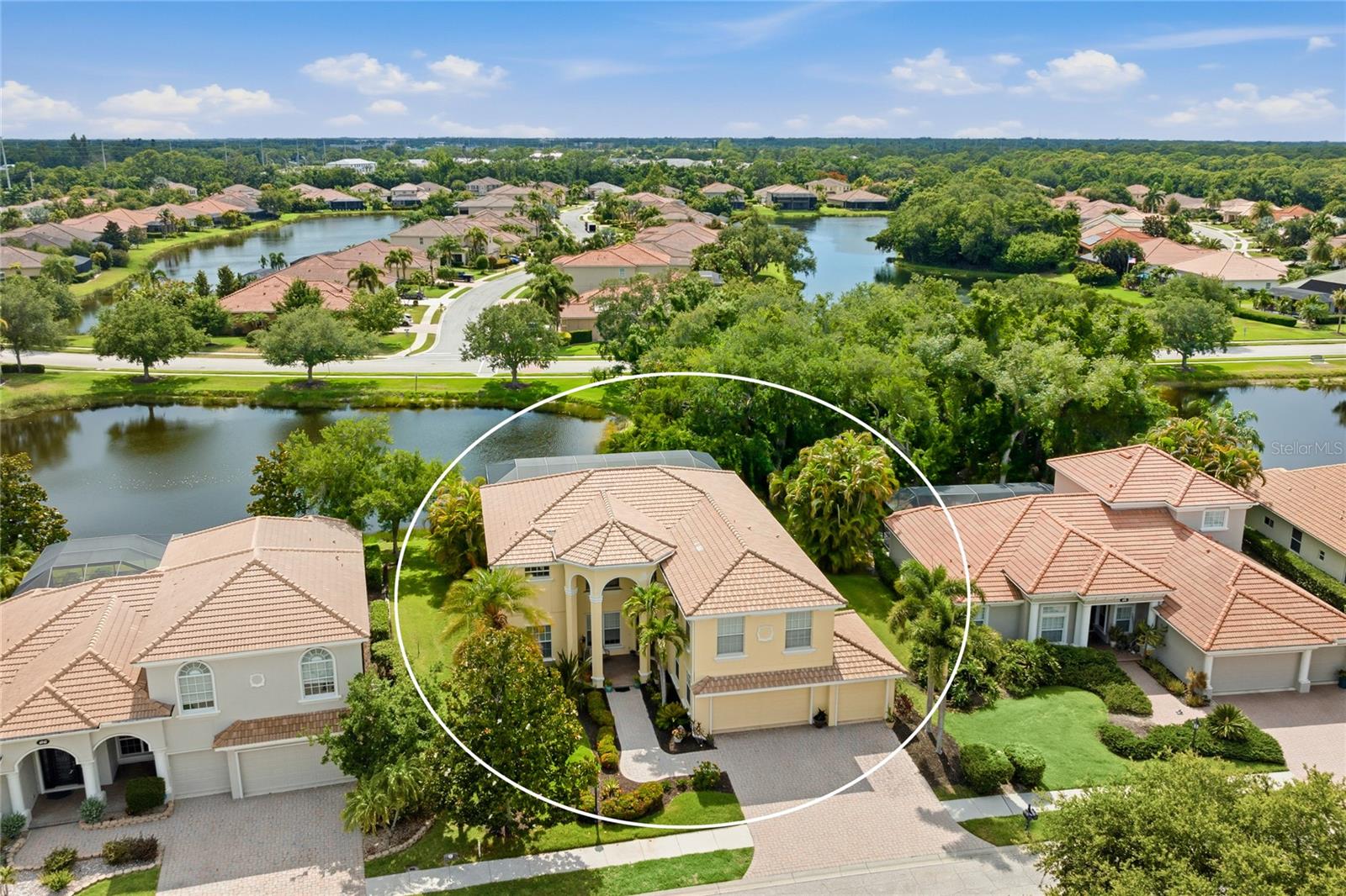 Elegant estate-style lakefront residence with breathtaking sunset and preserve views, offering exceptional indoor and outdoor living in the sought-after gated community of Red Hawk Reserve. Perfectly positioned on a premier lakefront homesite, this impressive two-story home features 5 bedrooms, 3 bathrooms, a bonus/game room, and over 3,800 square feet of living space, showcasing the highly desirable Grand Bristol LS V floor plan with timeless Mediterranean-inspired architecture, lush tropical landscaping, and a dramatic covered entry.

The outdoor living experience is truly one of this home’s standout features, thoughtfully designed for both luxurious entertaining and everyday relaxation. Enjoy an outdoor kitchen and bar, expansive covered living areas, a retractable awning with lighting, and breathtaking lakefront sunset views that create the ultimate Florida lifestyle setting. For peace of mind, the home features hurricane-resistant windows and doors on the front and complete hurricane panels for the rear.

Inside, soaring ceilings, crown moldings, and expansive living spaces are filled with natural light, creating a warm yet sophisticated atmosphere throughout. The open-concept kitchen is designed for both entertaining and everyday living, featuring granite countertops, rich wood cabinetry, built-in appliances, a large center island, breakfast bar, and a breakfast nook overlooking the main living areas.

The flexible floor plan includes a full downstairs bedroom suite or office, while upstairs offers spacious guest bedrooms, a large bonus/game room, and a private sitting area adjoining the luxurious primary suite. The primary retreat also features access to a private second-story screened balcony overlooking the pool, lake, and preserve—the perfect place to unwind and enjoy peaceful sunset views.

The versatile loft area provides the ideal space for a media lounge, secondary living area, or game room, while additional bedrooms offer exceptional comfort and privacy for family and guests. As evening approaches, retreat to your private outdoor oasis and unwind in the jacuzzi while taking in breathtaking sunset views over the water. Whether entertaining family and friends or enjoying a peaceful evening at home, this is Florida living at its finest.

Designed to embrace Florida’s signature indoor-outdoor lifestyle, the expansive screened lanai features a resort-style heated pool and spa, covered outdoor living spaces, and tranquil water views framed by mature oak trees and tropical landscaping. The lush grounds are maintained by a four-zone irrigation system utilizing reclaimed water.

Perfectly positioned across from the 123-acre Twin Lakes Park, this exceptional residence offers an unparalleled lifestyle surrounded by recreation, nature, and convenience. Just a 5-minute walk from your front door, enjoy miles of walking trails, newly appointed pickleball and tennis courts, and one of the area’s most robust sports and recreational complexes. The park is home to football and cheer programs, as well as soccer, baseball, and basketball, bringing activity to the neighborhood year-round.

Be sure to experience the immersive 3D Matterport virtual walkthrough. Schedule your private showing today and discover everything this remarkable lakefront estate has to offer.