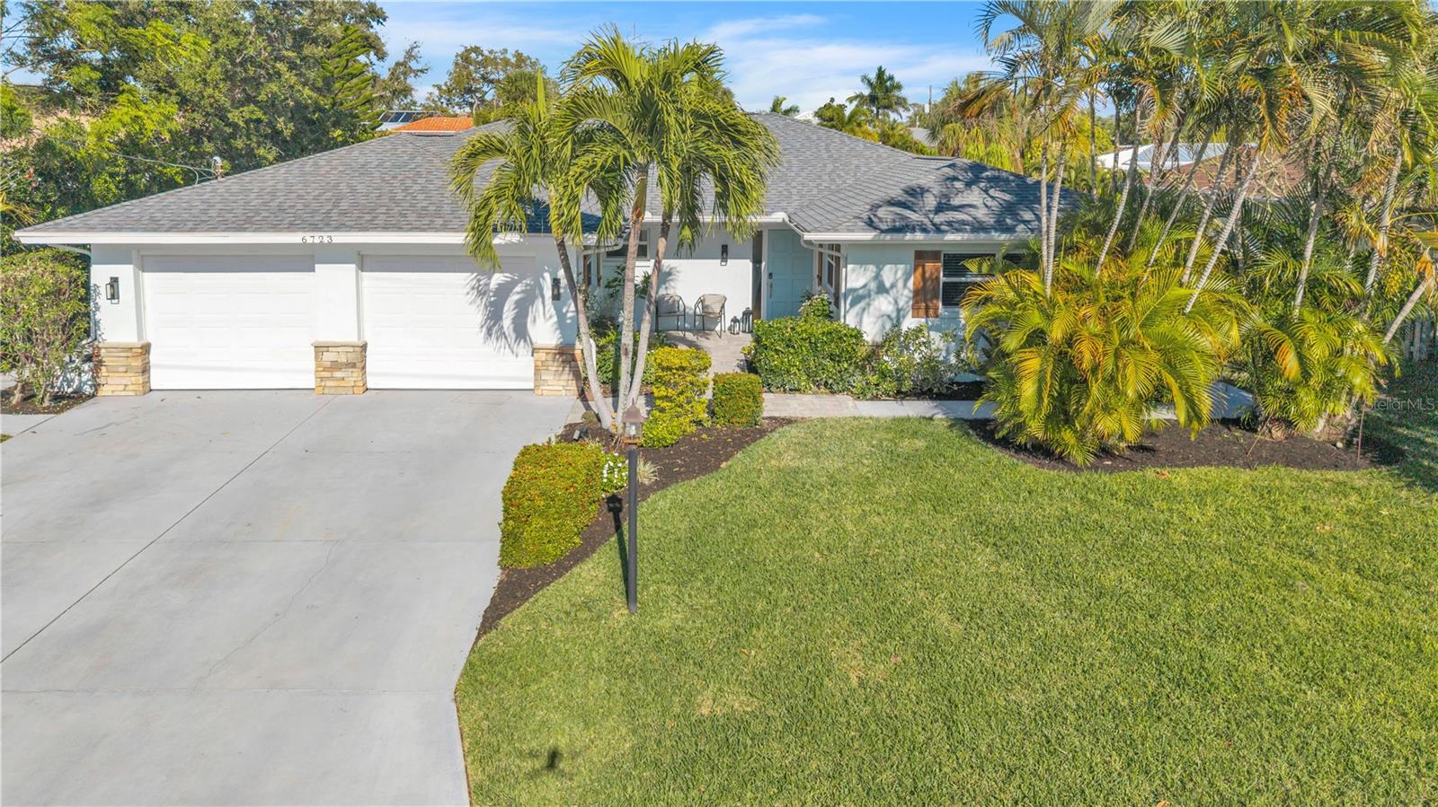 Location, location, location! Siesta Key - Private Boat Slip - Completely Updated - NOT in a FLOOD ZONE & No Hurricane damage!! Situated on Avenue C just before the South Siesta Key Bridge, this beautifully updated home offers an unbeatable coastal lifestyle. Enjoy less than a mile walk to the world-famous Siesta Key Beach, where you can take in stunning sunsets, white sand beaches, and relaxing weekends by the water. Boaters will love the easy access to the Intracoastal, just minutes away, with approximately 15 minutes to reach the Gulf of America. The home is also within walking distance to local restaurants and beaches, while being tucked inside a peaceful bird sanctuary, offering a rare blend of convenience and natural surroundings. Inside, the home has been fully updated. Improvements completed in 2020 include a NEW ROOF, tile flooring throughout, a brand-new kitchen, and updated bathrooms. The floor plan offers three bedrooms, including a SECOND PRIMARY SUITE, three bathrooms, and an oversized two-car garage. The backyard is designed for true Florida living, featuring a large heated pool, a spacious lanai with new panoramic screening, and a PRIVATE BOAT SLIP, one of only two slips in the entire neighborhood. The pool was resurfaced with new tile in 2025, and the dock was completed in 2025 as well. This home captures the best of coastal Florida living with walkability, boating access, and thoughtful updates throughout. Enjoy the neighborhood with a short walk to popular spots including Daiquiri Deck, Siesta Key Oyster Bar, Captain Curt’s Crab & Oyster Bar, The Old Salty Dog, Abel's ice cream, Ruth’s Chris Steak House, and Carrabba’s Italian Grill. With Publix Super Market and shopping just down the road, you can enjoy peace and quiet while still being close to everything you need. Schedule your own personal tour today!