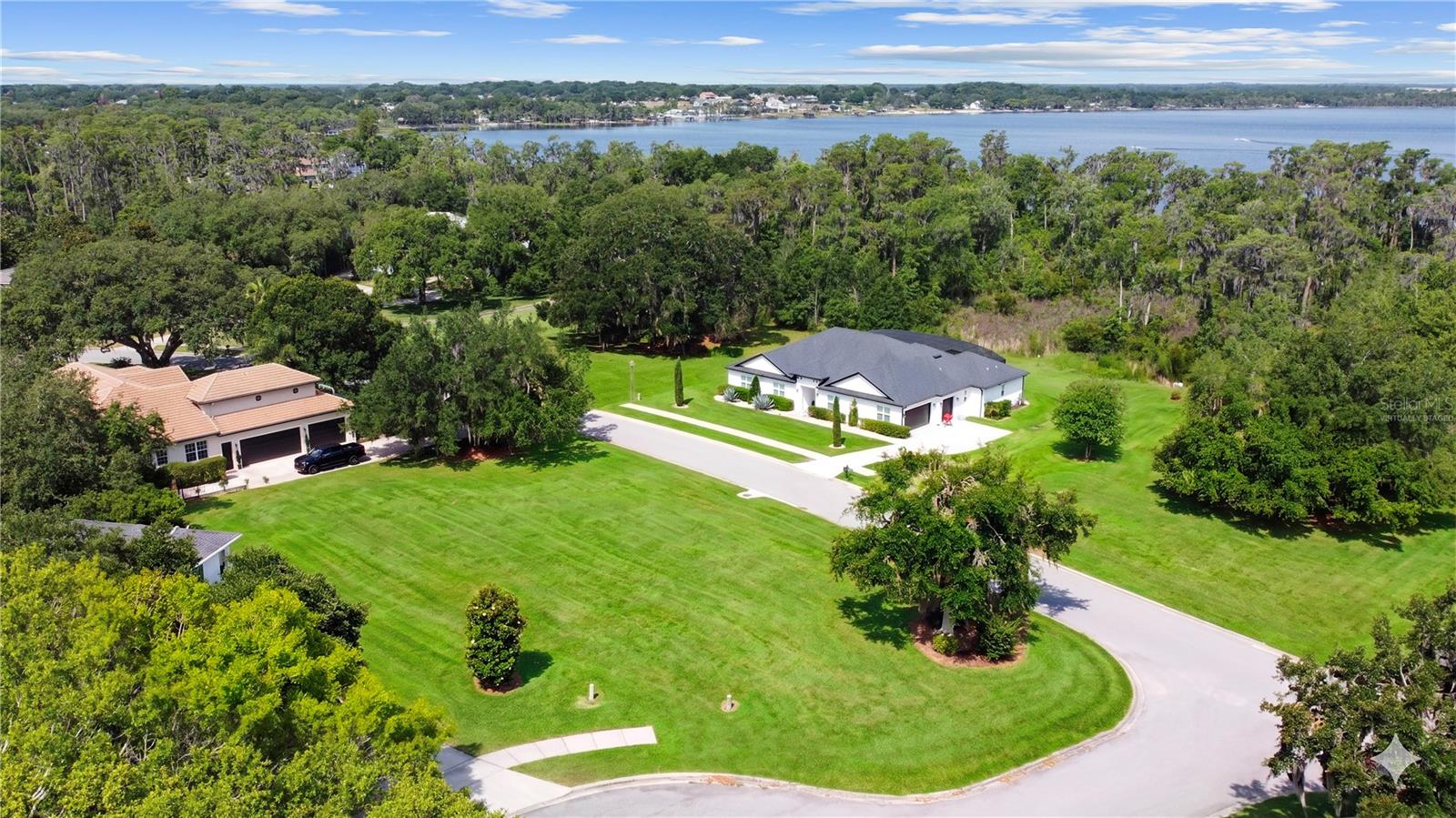 One or more photo(s) has been virtually staged. PRIME GATED LOCATION with Chain of Lakes Access! One of the few remaining estate lots in the gorgeous community of Osprey Pointe. This classic neighborhood has kept its prestigious reputation in a truly intimate setting of under 75 homes. Each home has its own personality and architectural style without feeling out of sync. The street curves around, revealing mature oaks, tropical foliage and one beautiful home after another! This feature, corner lot leads into a cul de sac and has been cleared aside from a few lovely trees. Traffic is never an issue in this quaint community with a secure gate system that is proudly maintained. Guest passes may be issued, but hardly a free for all for all the looky- loos driving around on the weekend! Adjacent to this lot is the private lake access to Lake Minnehaha! The “Nature Walk” leads you down a picturesque winding dock to expose the stunning panoramic Lakeview. There is no time frame on building, so stake your place for a future home or check out one of our amazing builders, we have a few models that will look fantastic on this lot! Be sure to check out the attached lake map! Lake County certainly lives up to its name! Enjoy boating to all 11 lakes in the south chain from your own community! A few favorite spots are Lake Louisa State Park, The Tiki Bar, Salt Shack or just chilling in the middle of the lake or exploring the Palatlakaha River! Boat club memberships make it easier than ever to experience life on the water without the hassles of ownership! Clermont was nationally recognized by Travel and Leisure as one of America's TOP 15 lake towns! Nicknamed years ago the "Gem of the Hills" and more recently "The Choice of Champions", Clermont appeals to all ages and all lifestyles! The hilly terrain and miles of shoreline bring world class athletes from around the world to train and compete! Visit the weekly Farmer's Market in Historic Downtown Clermont, seasonal festivities, specialty boutiques and yummy restaurants! There’s always something to do in this quintessential HOME TOWN! Enjoy Waterfront Park on Lake Minneola by day and when the sun goes down, the best spot to enjoy the annual 4th of July fireworks & Christmas boat parade! Truly a wonderful place to live! Another awesome feature is the West Orange trail that runs through town allowing you to take an afternoon bike ride to Historic Downtown Winter Garden! Of course a reasonable commute to Orlando, Disney and the Airport! Also just a few hours to the East or West coast beaches, welcome to Central Florida!