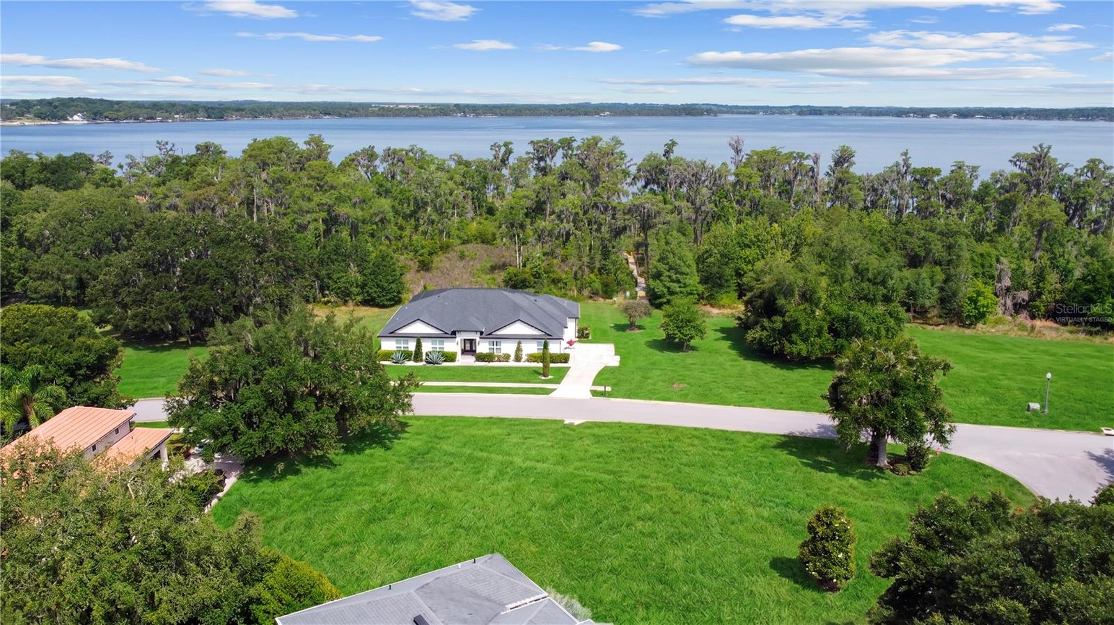One or more photo(s) has been virtually staged. Custom Homesite with Chain of Lakes Access! One of the few remaining lots in the gorgeous community of Osprey Pointe is now available. This classic neighborhood has kept its prestigious reputation in a truly intimate setting of under 75 homes. Each home has its own personality and architectural style without feeling out of sync. The street curves around, revealing mature oaks, tropical foliage and one beautiful home after another! This feature, corner lot leads into a cul de sac and has been cleared aside from a few lovely trees. Traffic is never an issue in this quaint community with a secure gate system that is proudly maintained. Guest passes may be issued, but hardly a free for all for all the looky- loos driving around on the weekend! Adjacent to this lot is the private lake access to Lake Minnehaha! The “Nature Walk” leads you down a picturesque winding dock to expose the stunning panoramic Lakeview. There is no time frame on building, so stake your place for a future home or check out one of our amazing builders, we have a few models that will look fantastic on this lot! Be sure to check out the attached lake map! Lake County certainly lives up to its name! Enjoy boating to all 11 lakes in the south chain from your own community! A few favorite spots are Lake Louisa State Park, The Tiki Bar, Salt Shack or just chilling in the middle of the lake or exploring the Palatlakaha River! Boat club memberships make it easier than ever to experience life on the water without the hassles of ownership! Clermont was nationally recognized by Travel and Leisure as one of America's TOP 15 lake towns! Nicknamed years ago the "Gem of the Hills" and more recently "The Choice of Champions", Clermont appeals to all ages and all lifestyles! The hilly terrain and miles of shoreline bring world class athletes from around the world to train and compete! Visit the weekly Farmer's Market in Historic Downtown Clermont, seasonal festivities, specialty boutiques and yummy restaurants! There’s always something to do in this quintessential HOME TOWN! Enjoy Waterfront Park on Lake Minneola by day and when the sun goes down, the best spot to enjoy the annual 4th of July fireworks & Christmas boat parade! Truly a wonderful place to live! Another awesome feature is the West Orange trail that runs through town allowing you to take an afternoon bike ride to Historic Downtown Winter Garden! Of course a reasonable commute to Orlando, Disney and the Airport! Also just a few hours to the East or West coast beaches, welcome to Central Florida!
