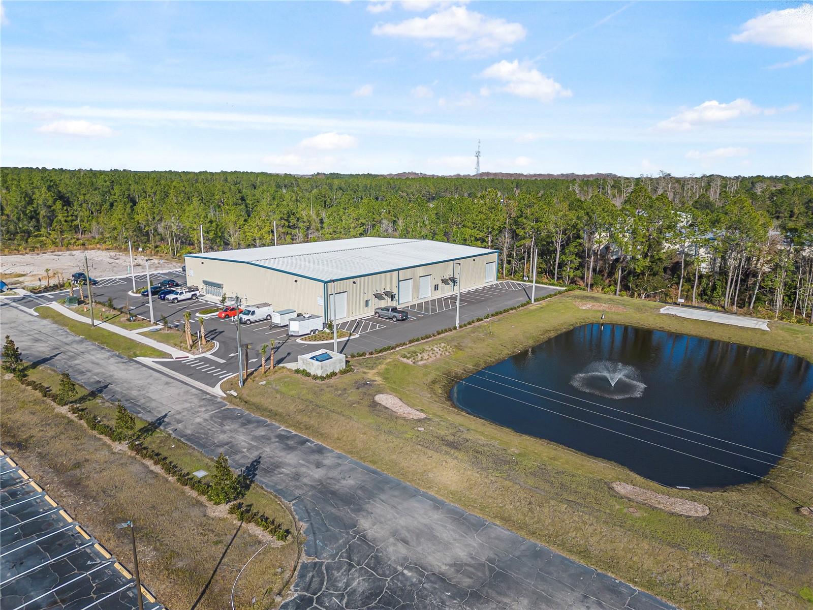 Under contract-accepting backup offers. Price Improvement for this great investment opportunity.  The property at 24 Hargrove Grade in Palm Coast, Florida, is a newly constructed industrial building of 20,000sf. The property has all utilities and infrastructure in place and will have a cross parking easement with 26 Hargrove.  Completed in 2024, the 20,000 sf building contains 8 units, each with a 14-foot high roll-up door, an office, a restroom and warehouse space.  The space is fully leased with annual  increases of the base rate.  The tenants pay the annual operating expenses for common area maintenance, taxes and property insurance.    The property is strategically located in the heart of Palm Coast, providing easy access to US Highway 1, Interstate 95, and Palm Coast Parkway.

Palm Coast, situated in Flagler County, has experienced significant growth in recent years. As of 2024, the city's population is estimated at 106,237.  The median age in Palm Coast is 50.3 years, indicating a mature population. 

The city's strategic location along Florida's east coast, combined with its growing population and economic indicators, makes it an attractive area for industrial and commercial investments.  Upon submission of a Non Disclosure, property financials will be made available to qualified buyers.