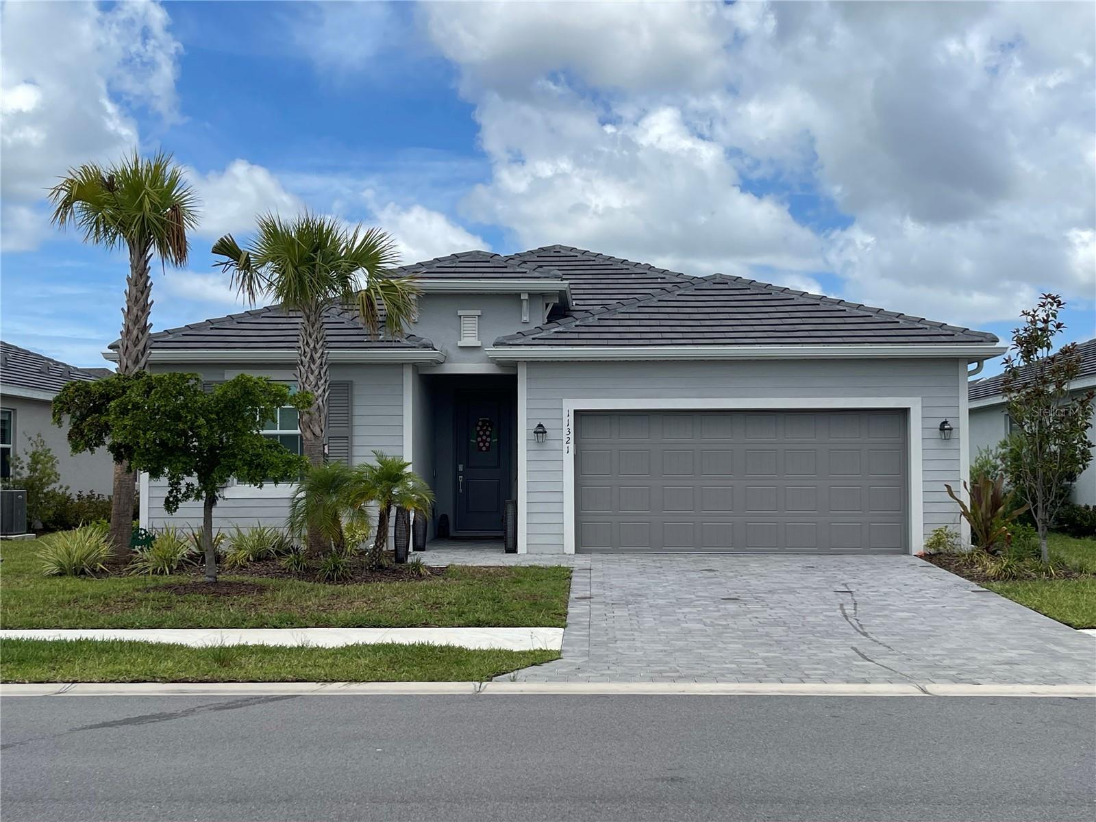 Welcome to your new home on the Coast of Southwest Florida.  Antigua at Wellen Park is a Private gated community, close to many amenities.  Cool Today Park, dining, shopping, entertainment, beaches, hospitals, I-75 and much more!  This stunning 3 bedroom, 3 full bath with den/study with open floorplan is ready for new owners.  It boasts a large open floorplan with kitchen, dining, living room and 3 separate split bedroom floorplan for extra privacy, with a secondary master that has it's own en-suite.  Some of the many features and upgrades include the following: heavy duty shelving and cabinets installed in the garage, brand new refrigerator with 3 compartments, freezer drawer, crisper drawer as well as french doors.  Five custom ceiling fans installed throughout the home, custom lighting, 4 TV's mounted with hidden electrical outlets/wiring.  The screened in patio has 2 additional electrical outlets added for easy access to power.  The home was also built with plan for a swimming pool/hot tub.  Upgraded shower head/wand in the master bathroom.  Custom remote sunshade installed on the sliding doors for energy efficiency on those hot summer days.
