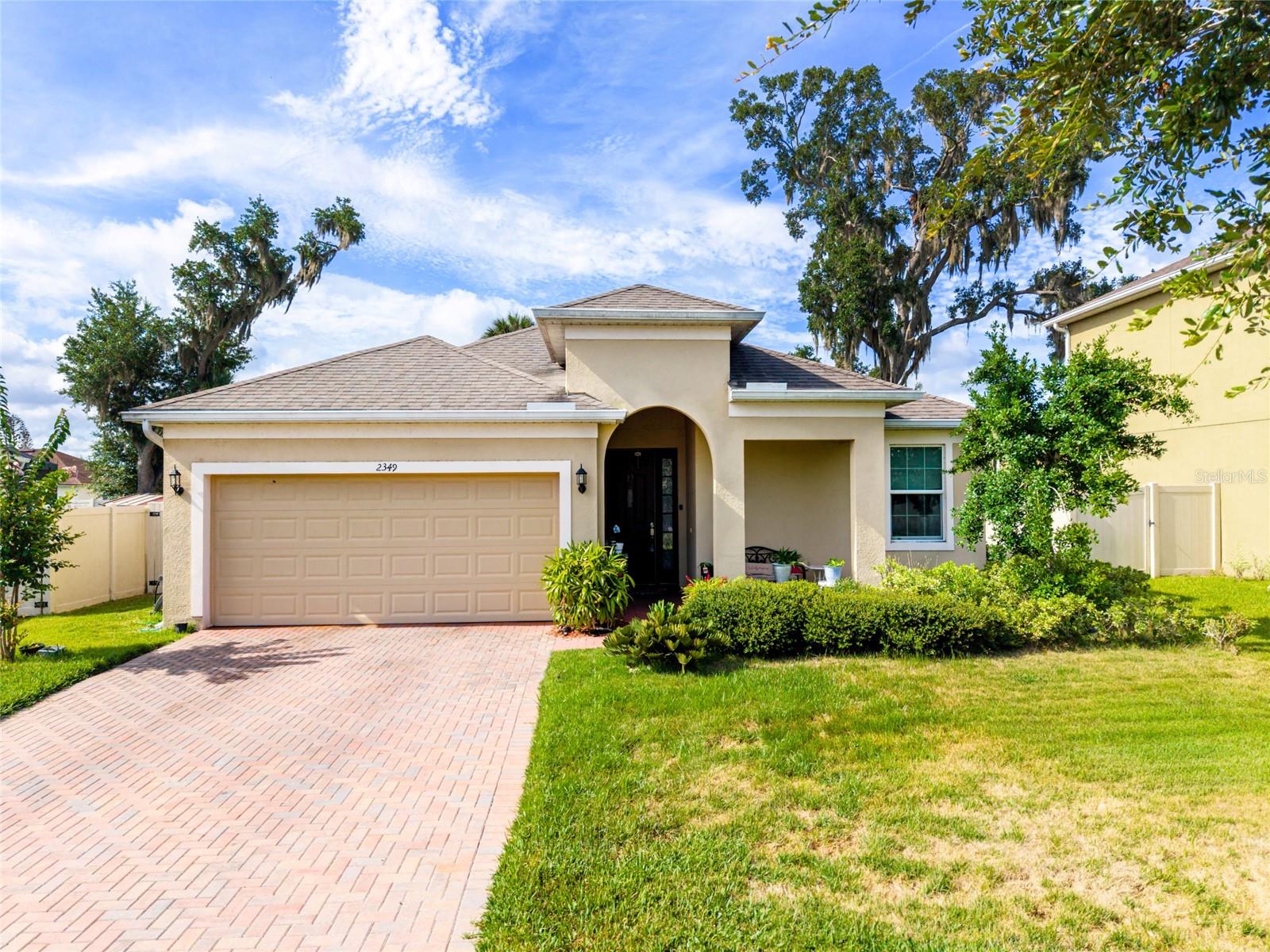 This beautifully maintained single-family home built in 2019, offers 2,006 square feet of comfortable living space with 3 spacious bedrooms, 2 full bathrooms, and a versatile office/flex room perfect for working from home, a playroom, or additional living space. 
The home features a modern open-concept layout designed for both everyday living and entertaining. The stunning kitchen boasts large white cabinetry, ample counter space, and flows seamlessly into the dining and living areas. The generously sized living room provides a welcoming space for family gatherings and relaxation.
The spacious primary suite features carpet flooring and a private bath, while the two additional bedrooms offer durable tile flooring. Tile flooring extends throughout the kitchen and main living areas, creating a clean and stylish look. A convenient washer and dryer hookup adds to the home's functionality.
Step outside and enjoy the screened-in sunroom overlooking the expansive backyard—perfect for family gatherings, outdoor entertaining, gardening, or simply relaxing in your own private outdoor retreat.
The house also has solar panels.
Located in the desirable Kissimmee area, this move-in-ready home combines modern features, spacious living areas, energy-efficient upgrades, and a fantastic outdoor space, making it an excellent opportunity for families and homeowners alike.
