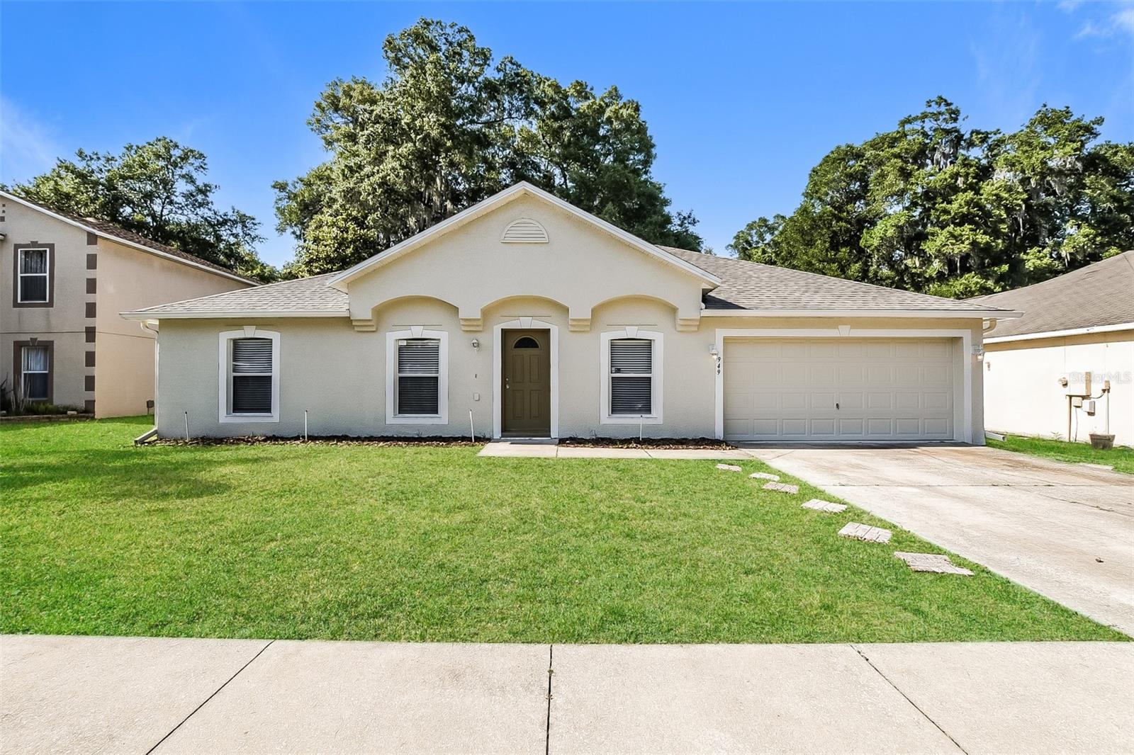 Charm and curb appeal abound for this Deland home! Step inside into the well-appointed living room, though the dining room, and into the kitchen, which boasts chic white appliances, hard surface countertops, and ample storage. This split, ranch style floorplan offers a primary suite and two secondary bedrooms separated by the family and breakfast nook areas. Come and see for yourself the possibilities that this home has to offer!