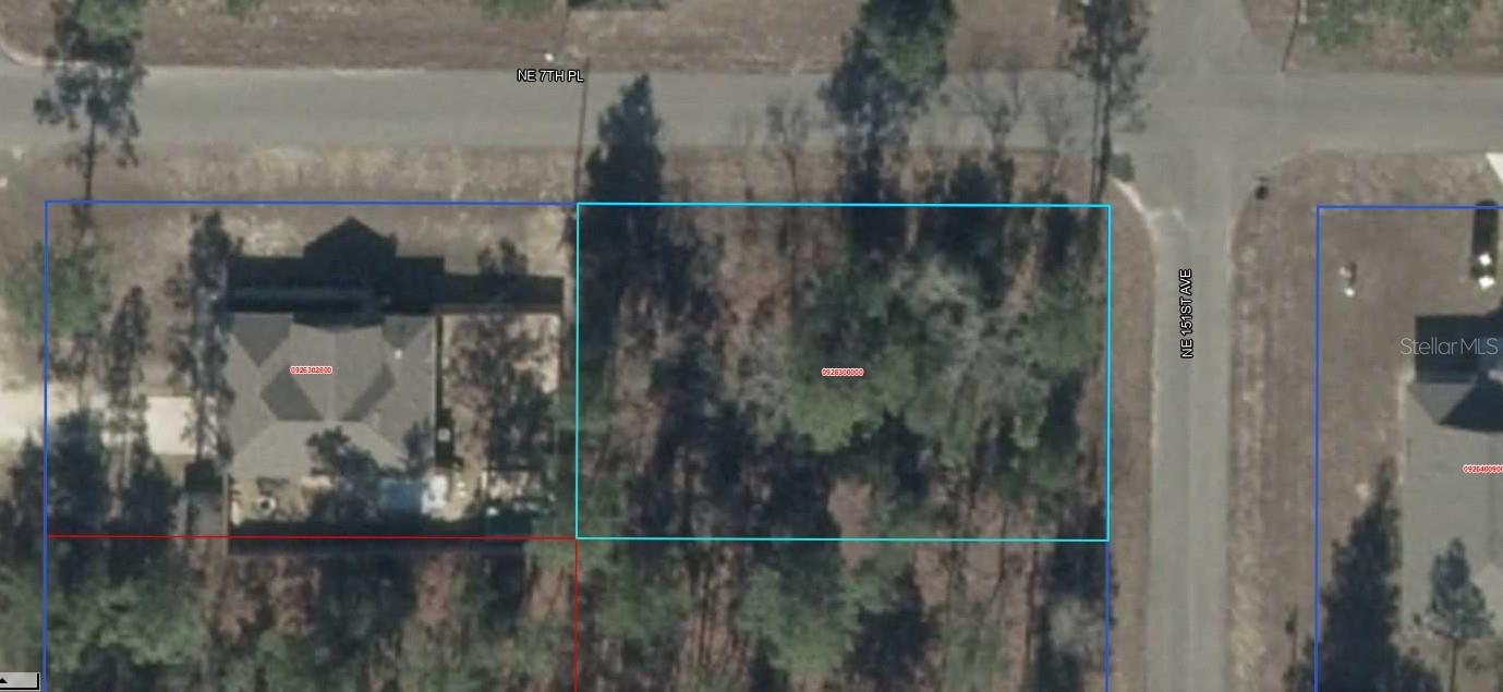 Flat buildable corner lot on two paved roads, new homes nearby!