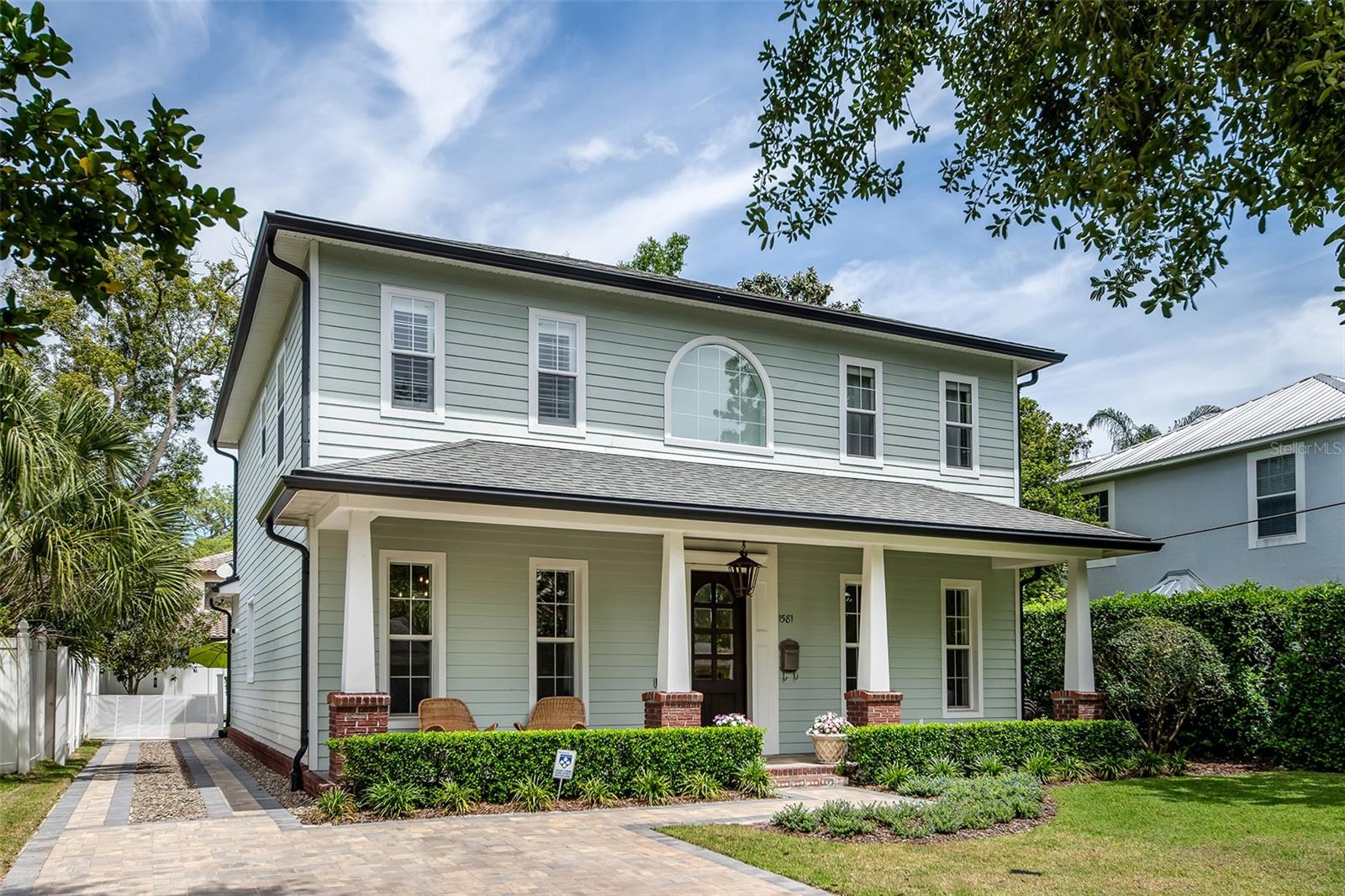 Beautifully updated with a refined, welcoming feel, this two-story home sits on a charming brick-lined street in the heart of Winter Park, just minutes from the shops, dining and parks that make the area desirable. Natural light fills this home, with four bedrooms and four full baths with custom details throughout including wonderful wood flooring throughout the first level. The well designed open kitchen is inviting centered around an oversized island with a beverage refrigerator, granite countertops, new backsplash, five-burner gas range with double ovens, range hood, pantry and abundant wood cabinetry. It flows easily into the family room with a gas fireplace and views of the private backyard and covered patio creating an expanded everyday living space. A separate dining room with a custom wainscoting accent wall offers a polished yet relaxed setting for gatherings, while the nearby laundry room features a butcher block countertop, custom shelving and excellent storage. The first floor bedroom, currently used as a playroom, sits next to a marble-floored full bath and works equally well as an office, gym or guest space. Upstairs, a cozy landing provides an additional flex area, while the attractive and spacious renovated primary bath includes dual sinks, granite counters, a soaking tub, separate walk-in shower and a huge walk-in closet. Two additional bedrooms share a new Jack and Jill bath each with its own separate sink area. Storage is thoughtfully integrated throughout with custom closets and additional space under the stairs, complemented by plantation shutters, crown molding and substantial baseboards on the main level. The detached guest house adds rare versatility with its full bath, custom cabinetry and large walk-in closet, ideal for guests, a private office or creative studio. A long matching pavered driveway provides ample parking and completes the home’s distinctive curb appeal. Zoned for top-rated Dommerich Elementary, Maitland Middle and Winter Park High. Schedule your private showing today and experience a home that stands apart from the ordinary. You will love living here!