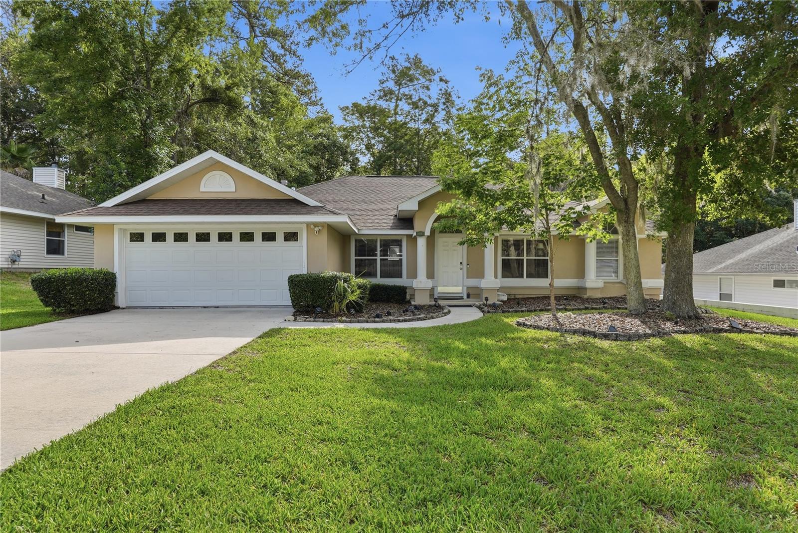 Beautiful and updated POOL HOME in Broadmoor! This home features soaring vaulted ceilings with tons of natural light, updated HAND-SCRAPED wood flooring, open chefs kitchen with STAINLESS STEEL appliances and GRANITE counters, expansive family room with wood burning fireplace over looking the sparking pool. Master suite features wood floors, separate sitting room/office/nursery, and large master bath with dual vanities, jetted tub, and shower. Large guest bedrooms have wood floors and plenty of closet space. Enjoy summer days with your sparkling pool with fountain, huge fenced in backyard with no rear neighbors! All of this in an unbeatable location close to NFRMC, UF, grocery stores, parks and easy access to I-75! New roof and hot water heater 2023!