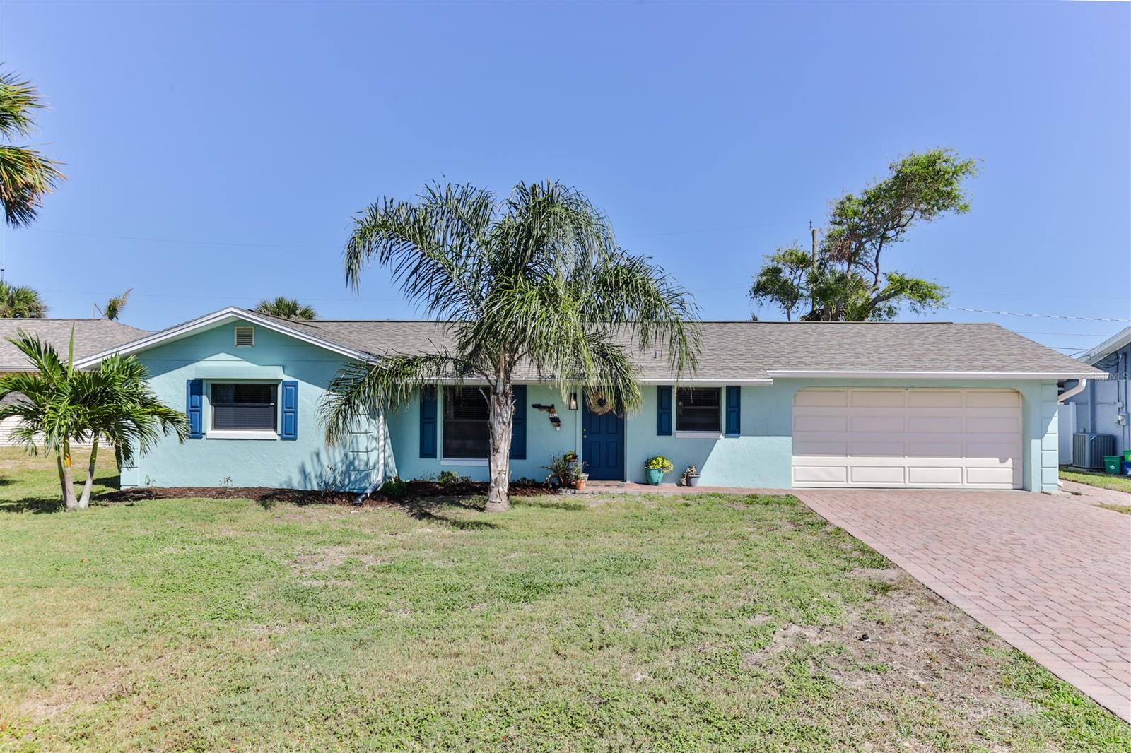 Welcome Home to your New Smyrna Beachside retreat!!  Only a short stroll to this coveted portion of the no-drive beach here in NSB.  Launch your canoe, kayak, paddle board, gheenoe, or shallow water boat at the community boat launch.  Only 4 miles to Flagler ave and minutes to some of New Smyrna's World Class Restaurants and Shopping.  This 2 bedroom 2 bath home is very spacious and offers many updates to suit your needs.  New Roof in 2017.  AC was replaced in 2022.  Your new Primary Bedroom has 2 spacious closets as well as En-Suite bathroom with walk in shower.   Bonus Florida Room adds extra living space looking over your gorgeous new backyard.  Could easily be converted to a 3rd bedroom.  Heavy duty storm shutters make closing up the house a breeze.  Over sized 2 car garage, a rare feature on many beachside homes.   Enjoy Outdoor Living and the Ocean Breeze in your tropical backyard with brick pavered patio and mature landscaping.  Plenty of room for a pool on this large lot.  Extra storage is available with your new oversized 10 x 16 outdoor shed.  Interior recently painted as well as new on trend interior doors installed.    Isn't it time you start "Living the Dream" in New Smyrna Beach today..... ;Water: City
