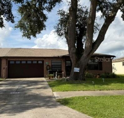 Adorable 2/2 half duplex with oversized 1-car garage w/laundry is perfect for snowbird living, first time buyers, or investment potential too!  The garage features pull down attic access and the owner has added extra insulation for added efficiency.  Updates in 2024 include a spacious refrigerator, range w/convection cooking as well as air fryer, and updated guest bathroom.  The solar panels installed in 2020 keep the power bill super low--average $30 monthly!  There is a 12x27 patio at the back for afternoon BBQ's and a 10x12 resin storage shed for toys and landscaping needs.  For $165 a year (optional) you get access to the community pool, the clubhouse that has community events and is also available for private rental.  Centrally located to shopping, dining, doctors, the beach, and boat ramps.  This home has been lovingly maintained and updated--in move in condition and ready for new owners!