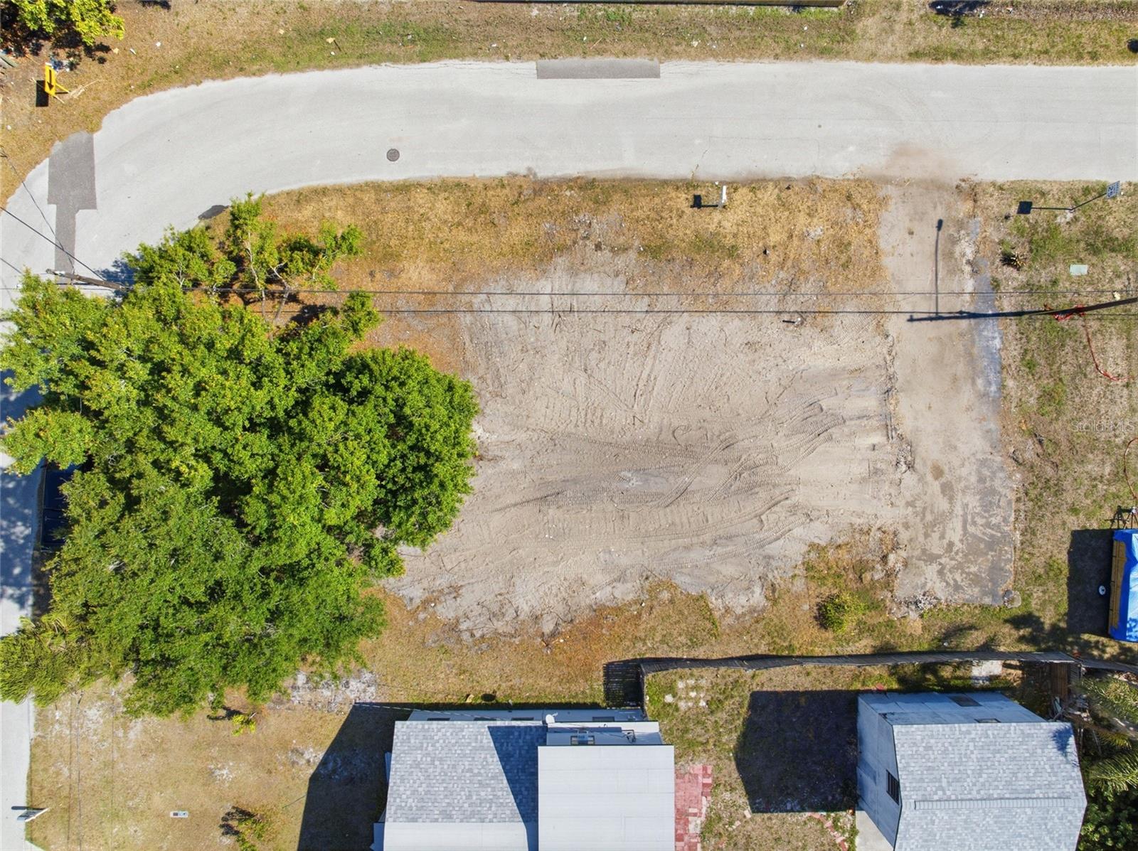 Positioned on a freshly cleared corner lot in a rapidly growing and up-and-coming neighborhood, this exceptional property offers the perfect canvas for your next home or investment opportunity. Zoned T-1, the lot allows for new construction single-family residences or mobile homes, giving buyers flexibility to bring their vision to life — buyers are encouraged to verify all building and zoning requirements directly with the city. A recent survey completed prior to the removal of the previous structure is available for review, providing valuable information regarding setbacks and future planning. The old foundation has already been removed, and an existing driveway remains in place, adding convenience and saving time toward the building process. Located in an X flood zone, flood insurance is not currently required for future improvements, offering added peace of mind and potential savings for owners. Public utilities including water, sewer, and electricity are already present, making this property primed and ready for development. Whether you're looking to build your dream home or invest in an area with exciting future potential, this private, build-ready lot is an opportunity you won’t want to miss.