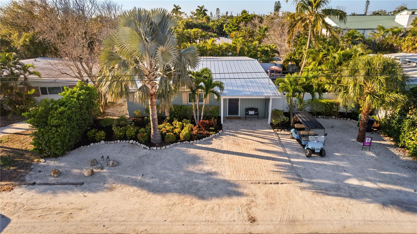 WELCOME to Bimini Bay – Your Oasis Awaits!  Step into your dream getaway at Bimini Bay, where this stunning home offers everything you need for the perfect beach house in paradise. Ideal for both vacationers and renters alike, this four-bedroom, three-bathroom retreat is nestled in the charming heart of Anna Maria.  As you enter Bimini Bay, you'll be greeted by high ceilings and an expansive living room that beckons you to unwind. The open-concept floor plan features a delightful kitchen designed for culinary adventures, ensuring that you’re always part of the action. The inviting primary bedroom is located on the West side, conveniently paired with a guest room just across the hall, while a full bathroom nearby serves as your pool bath.  The two additional bedrooms on the East side of the home are perfectly situated next to the kitchen and the third full bathroom, offering ample space for family and friends. With its cheerful beach colors and spacious layout, Bimini Bay is designed for relaxation and enjoyment.  Open the two sets of sliding doors off the living room to reveal spectacular views of the oversized pool area with lush landscaping, outdoor grill and dining. Picture yourself lounging on the sun ledge, sipping your favorite island drink with your toes in the water. Just outside, enjoy alfresco dining after grilling your catch of the day in paradise.
Whether you're staying in to relax or rejuvenating after a beach day, Bimini Bay provides the perfect atmosphere. Located just 2.5 blocks from the world-famous beaches of Anna Maria and close to the vibrant shops and eateries of Pine Avenue, this home truly offers convenience and charm.  Don’t miss out on the opportunity to make Bimini Bay your new sanctuary! Come live the Anna Maria life and see your future home today!