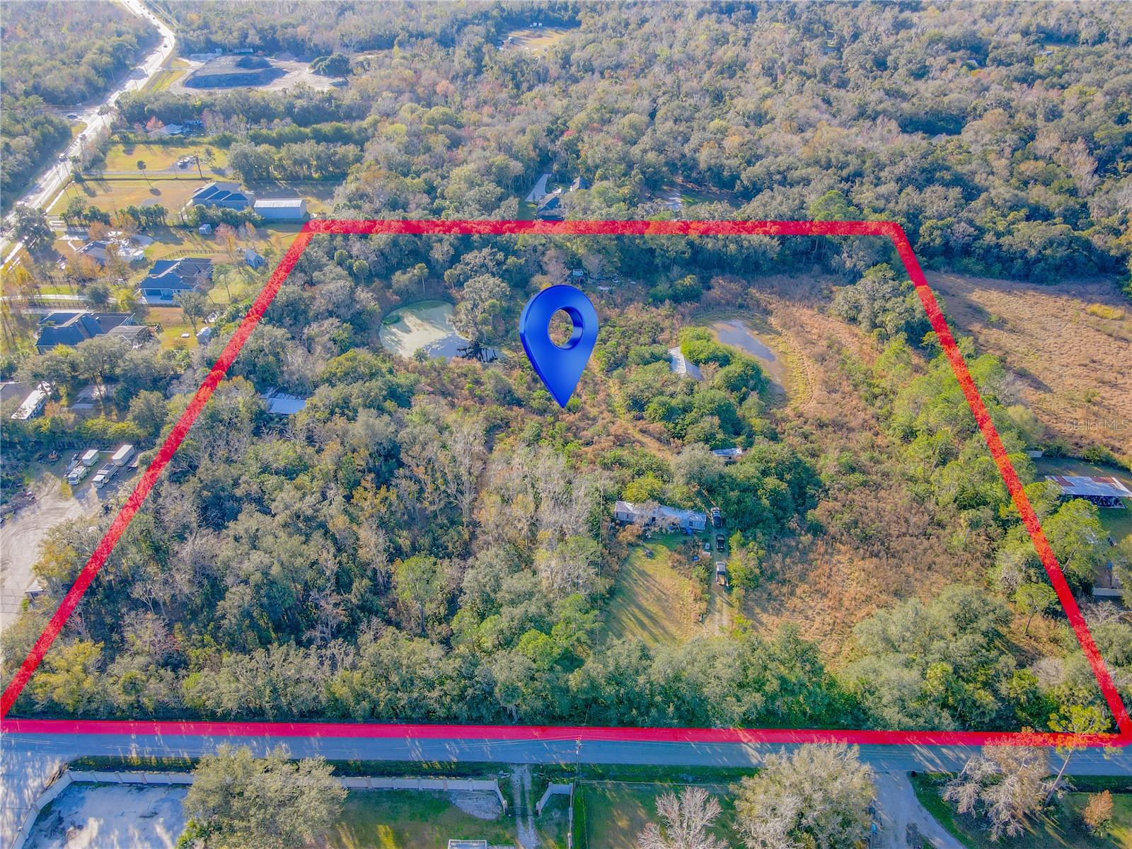 DEVELOPMENT OPPORTUNITY: RARE 9+ ACRES IN OVIEDO'S PREMIER ZIP CODE.
Discover a truly exceptional investment prospect. This property represents a scarce opportunity to acquire approximately 9.35 sprawling acres of serene, pristine land in the highly coveted 32765 zip code of Oviedo.
While a modest, existing structure (576 sq ft 1/1 manufactured home) sits on the property, the substantial value here lies entirely within the raw, expansive acreage. This blank canvas is ideal for multiple potential uses:
PRIVATE ESTATE: Build the secluded, custom dream compound you’ve always imagined, while remaining just minutes from urban convenience.
SUBDIVISION POTENTIAL: Experienced developers and builders, explore the possibility of creating a boutique enclave of luxury homes (buyers must verify zoning, setbacks, and density requirements with Seminole County).
AQUIFER/AGRICULTURE: A perfect setting for equestrian use, gentleman farming, or a private retreat.
Enjoy the ultimate combination of tranquility and accessibility. This property is nestled away from the bustle, yet offers convenient access to top-rated Seminole County Schools (Oviedo High!), the University of Central Florida (UCF), high-tech employers, and the charming downtown Oviedo scene.
Opportunities of this scale and location are increasingly rare in Oviedo. The existing structure is conveyed "as-is," allowing you to immediately begin planning your vision. Bring your architect, bring your builder, and unlock the massive potential of this exceptional acreage.