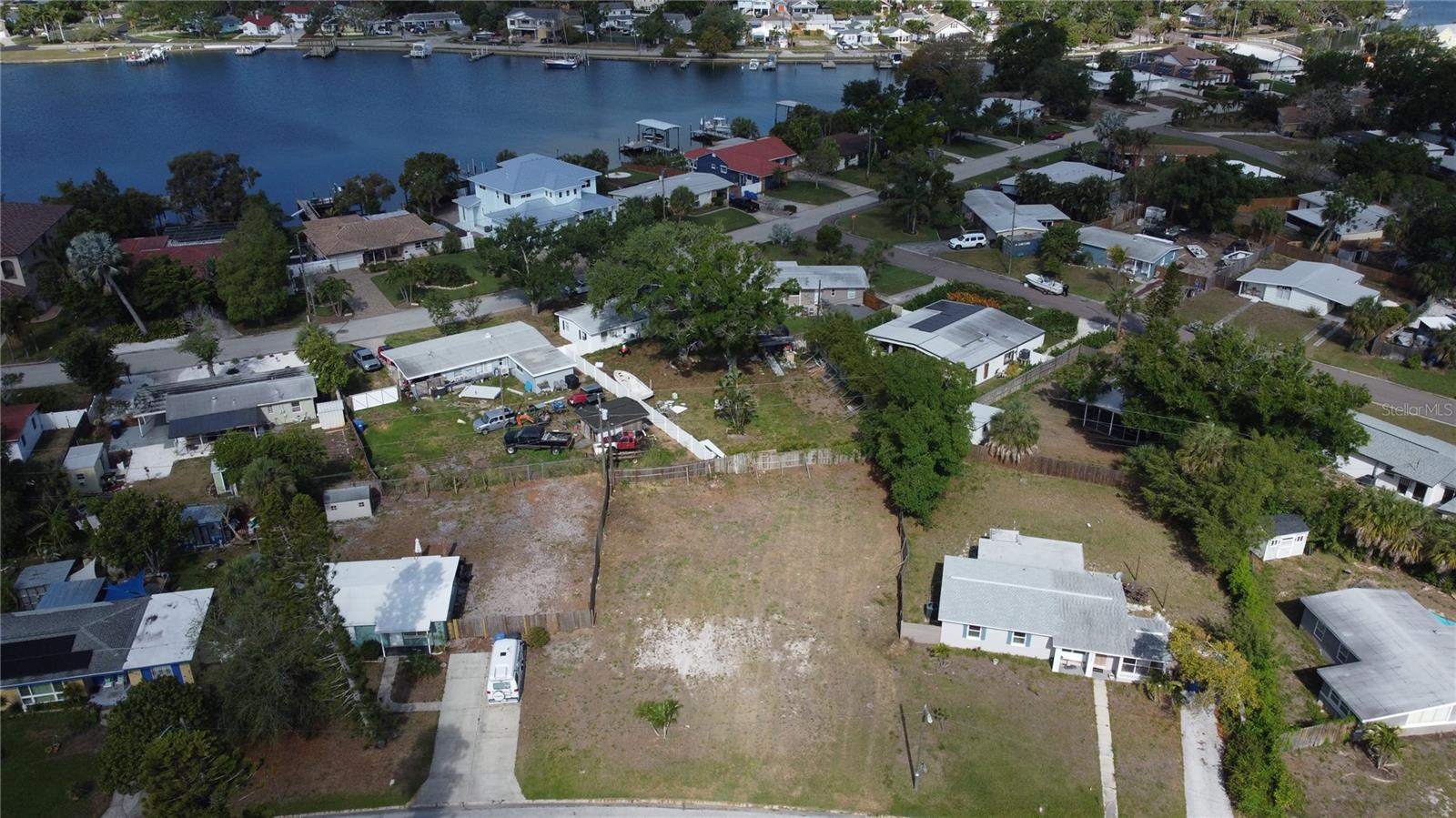 Imagine ending every day with a sunset view from your own backyard on Coquina Key. This rare 10,000+ square foot lot — one of the few remaining of its size on the island — gives you the space to build the home you've been picturing, plus room for an ADU, guest house, rental unit, or in-law suite. It's flexibility and income potential that's getting harder to find here.

The groundwork is already done, too. The lot's been cleared, the boundary survey is complete, and geotechnical soil compaction testing is finished — saving you real time and money before construction even starts. Buildable plans are also available for a 4-bedroom, 3-bath, 2,800-square-foot hurricane-resistant home with a first-floor garage and elevated living space above.

You're an easy walk to Coquina Key Park, with pickleball, tennis, basketball, soccer fields, a dog park, and fishing access right there, plus public boat ramps just minutes away. Downtown St. Petersburg is about 10 minutes out, and the Gulf beaches are 20 — close enough to everything, quiet enough to feel like its own world.

Lots like this rarely come up on Coquina Key. Seller is open to Bitcoin as payment.