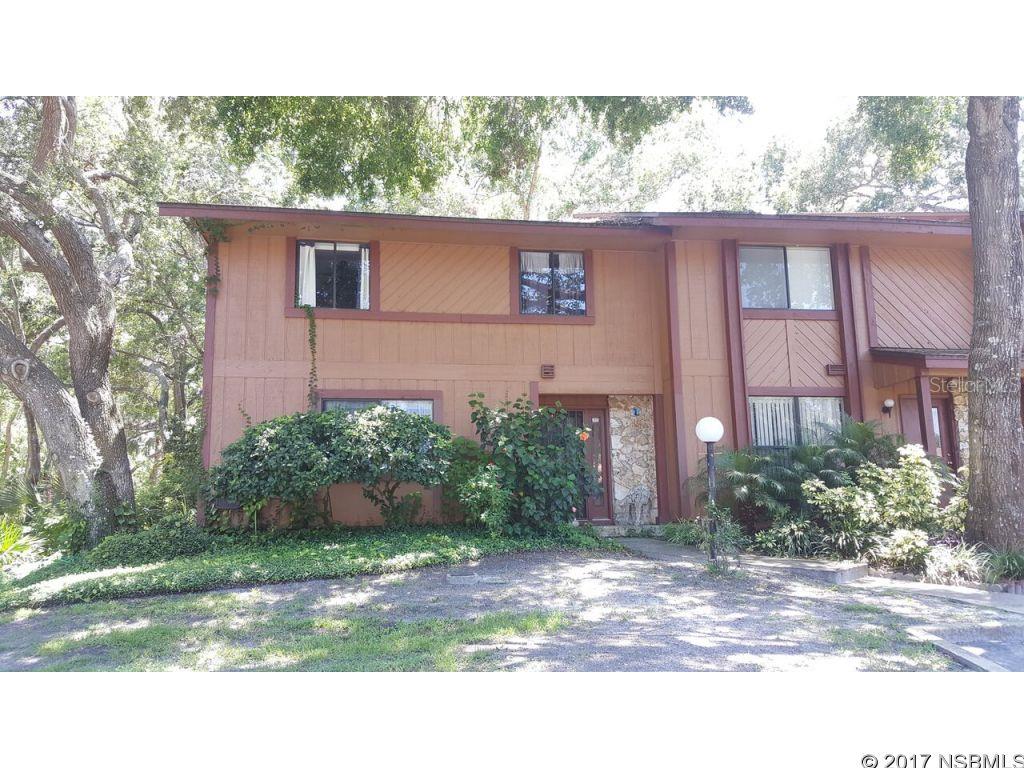 This property is located in a well established area of Ormond Beach.  Its rare to find one of these Townhouses available for sale.  This Gem is nestled back into a maintained wooded area with updated landscaping all covered by the Home Owners Association.  For a monthly fee of 115.00.   Which also includes all exterior paint and roofing.  For an extra cost of 204.00 a year you would have access to the community pool at Lake Bridge.  There has been some minor updates but has the ability to make it your dream residence. If your looking for space this unit has one bedroom on main floor with full bath.  Upstairs you will find two large size bedrooms with full bath.  Not to mention there is also a loft that gives you plenty of possibilities.  Don't let this one pass you by.  Schedule your showing today. ;Water: City