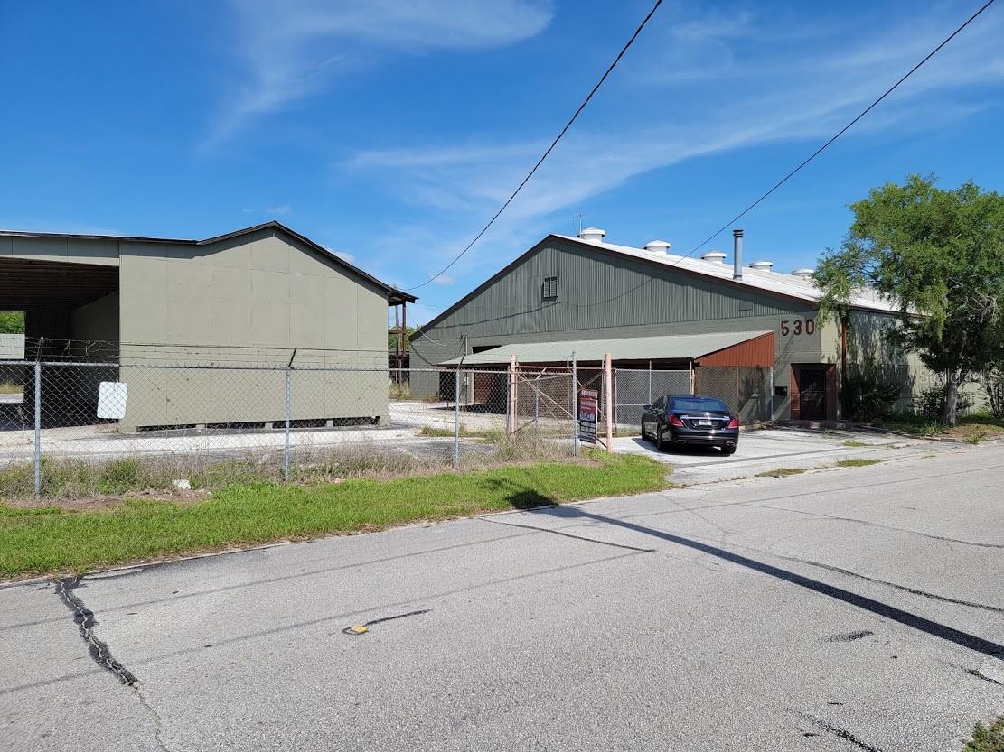 This property is a large industrial warehouse office with a fenced yard, located on 2.45 acres in downtown Ocala. It was formerly a lumber yard and offers various possibilities for redevelopment. However, it's important to note that any redevelopment plans would require rezoning of the property.

The site holds potential for different uses, such as office space, multi-family housing, or apartment development. Rezoning would be necessary to accommodate these new purposes. Depending on the location and other factors, the property may also qualify for opportunity zone benefits and City of Ocala Credits, which can provide certain incentives for investment and development.

In addition to the potential for redevelopment, the property is also available for lease starting January 2024, with a monthly rent of $5,500.