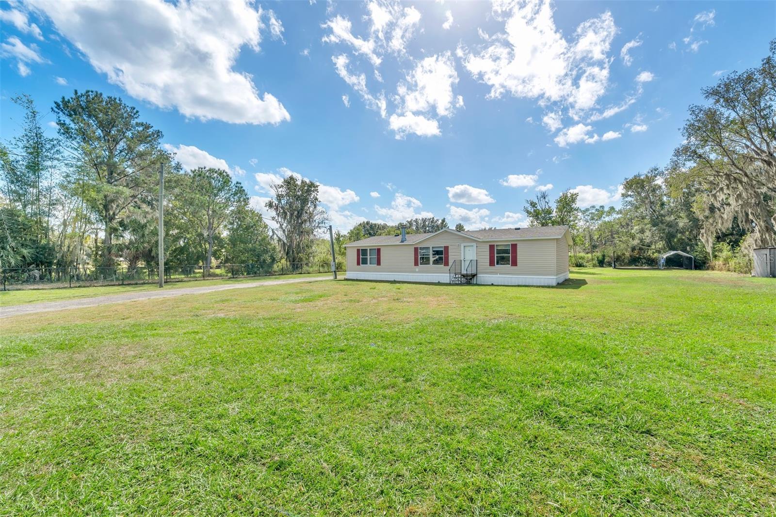Buyer's Financing fell through, so this is your chance to...Discover your ideal home in this spacious 3-bedroom, 2-bath double-wide manufactured home boasting 1,404 square feet of comfortable living space. Built in 1999, this well-maintained residence offers modern conveniences and a serene setting on 1.18 acres of land. Step inside to find a warm and inviting living space complete with a cozy fireplace, the perfect focal point for relaxing evenings with family and friends. The open floor plan creates a seamless flow between the living, dining, and kitchen areas, making it ideal for entertaining and daily living. This home has seen thoughtful updates, including a new roof replacement in 2016 and a new well that was installed in the same year. Step outside onto the back deck, where you can unwind and enjoy the tranquility of your surroundings. The expansive lot offers plenty of outdoor space for gardening, play, or simply soaking in the natural beauty of the pond and the landscape. To protect your vehicles from the elements, a detached carport is included, adding both convenience and functionality to this property. With over an acre of land, there's ample elbow room for your outdoor projects and activities, giving you the freedom to make this space your own. Embrace the charm of this welcoming manufactured home, where modern amenities blend seamlessly with the beauty of nature. Make this your haven and create a lifestyle filled with comfort, space, and the joys of rural living. Don't miss this opportunity to make this house your cherished home. Reach out today and take the first step toward making it yours!