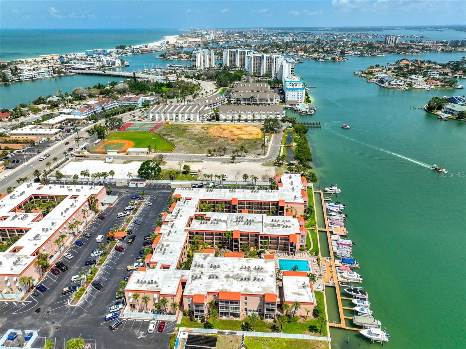 Are you looking for a property that supports your passion for boating and beach living? This recently renovated 2-bedroom, 1.5-bathroom condo in the gated Boca Shores community is designed for the ideal Florida lifestyle. The home features a modern coastal design with a kitchen equipped with light grey soft-close cabinets, speckled quartz countertops and all new Frigidaire appliances. Spacious living and dining areas are filled with natural light through new high-impact windows overlooking the beautifully manicured courtyard. The primary suite includes a generous walk-in closet, an ensuite half-bath and a new high-impact sliding glass door leading to a garden patio. The 2nd bedroom also has a new high-impact window and a spacious wall to wall closet with double doors. The main bathroom vanity matches the cabinetry throughout as well as a beautiful tiled shower and bathtub. The hallway features 2 additional storage closets to hold all of your beach & pool toys. Additional upgrades include a new GE electrical panel and an Eemax tankless water heater. Boca Shores offers exceptional amenities, including a heated pool, fishing dock, kayak & bicycle storage and a recreation center. Residents may also lease boat slips for approximately $91 per month, subject to availability. This pet-friendly community allows up to two small pets and is located directly next to St. Pete Beach City Park, tennis courts and is walking distance to local restaurants, shopping, and beaches. With easy access to the SunRunner, downtown St. Petersburg and major airports, this location offers both convenience and a stress-free lifestyle. Whether you are seeking a primary residence, a weekend getaway or an addition to your investment portfolio, this property is an exceptional choice. Schedule your private tour today.