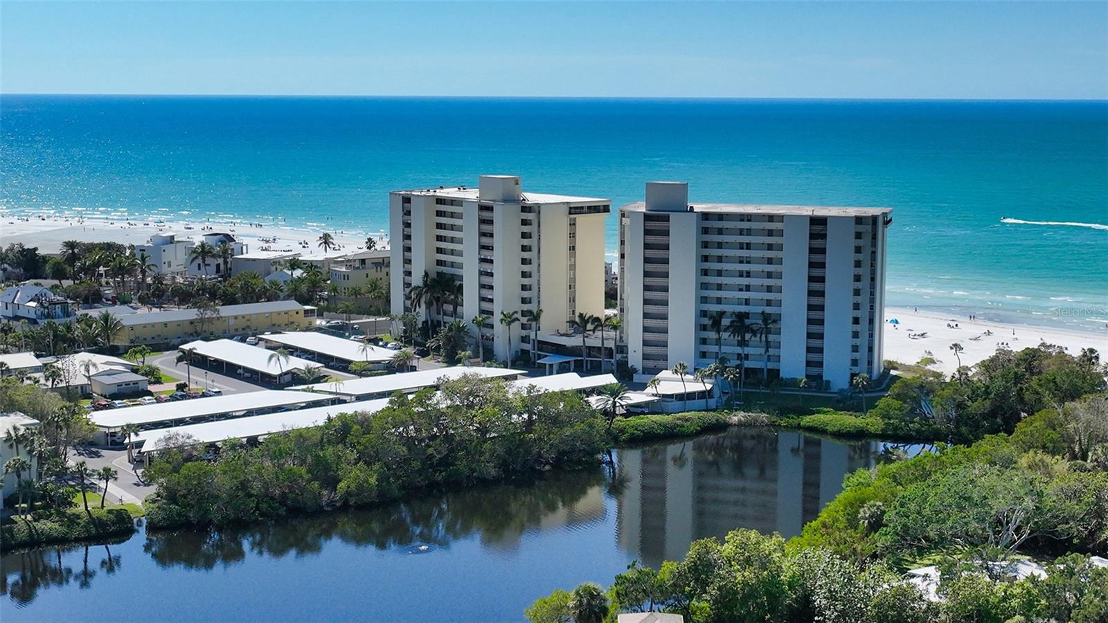 Embrace the rare opportunity to own a GULF FRONT residence in the coveted Siesta Key community of Whispering Sands – where breathtaking FULL GULF views, an unbeatable location, and endless potential come together. This 2 bed/2 bath 2nd floor tower unit showcases panoramic vistas of the shimmering Gulf, on 800’ of your own PRIVATE quartz sand beach, and the nightly spectacle of vibrant symphonies of colorful sunsets from your expansive 24’ open-air balcony. Offered in largely original condition, this residence is a true blank canvas—an exceptional value in today’s buyer’s market and the perfect chance to design and remodel from top to bottom in your own personal style. Create the coastal retreat you’ve always envisioned while investing in a premier Gulf front address known for its timeless appeal and strong long-term desirability. Reputable contractor names are available to help bring your vision to life. Life in the sought after 55+ community of Whispering Sands is peaceful and resort inspired.  Enjoy two heated, fenced pools with new travertine decks, beach loungers for the exclusive use of owners and their guests, beachside Tiki Hut, gas grills, shuffleboard, canoe/kayak storage, and a beautifully soon to be remodeled clubhouse and Tower Lounge—the latter of which is reserved for the exclusive use of tower residents outside community events, and conveniently located on your floor.  You’re also just an elevator ride down to the sparkling Gulf side pool and powder soft sand. Ideally positioned just moments from Siesta Key Village, you can leave your car behind and stroll to charming boutiques, live music, and an array of dining options. End each day with your toes in the sand or on your private balcony, savoring the tranquil rhythm of the waves and the company of friends as the sun melts into the horizon. This is more than a condo—it’s a lifestyle, a legacy of memories in the making, and a chance to secure your own piece of world class Gulf front paradise.