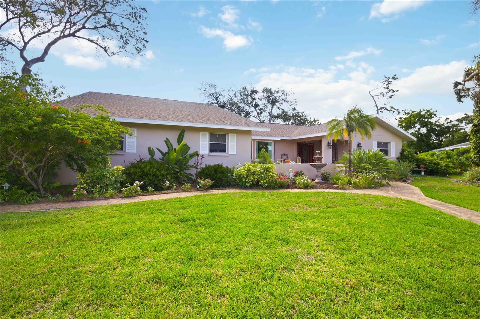 Welcome to Country Place, one of Sarasota’s most desirable neighborhoods.  This 6 bedroom, 3 bathroom home offers over 3,500 sq ft of comfortable living including 2 separate loft bedrooms, perfect for multigenerational families, home offices or additional living areas.  The well-designed split plan offers plenty of flexible space for everyone and everything. The main living room area lets in plenty of natural light and features vaulted ceilings and a wood-burning fireplace.  Generous living and dining spaces offer functionality and comfort, with upgraded bay windows and genuine wood floors.  The kitchen was remodeled in 2021 with granite countertops, stainless steel appliances and a large island.  The home has plenty of storage options with a spacious laundry room and plenty of oversized closets. 
Set on a beautifully landscaped lot, the property showcases mature gardens and lush tropical surroundings, creating a private, oasis-like setting. The large screened-in lanai boasts a 40 foot pool with waterfall and plenty of space for relaxing and enjoying outdoor living.
***New roof 2024, New Irrigation Well 2026, New AC 2018, New Garage Door 2018, Pool Resurfaced 2015***
Conveniently located in Sarasota near Siesta Key beaches, top rated schools, shopping, dining, hospitals, Red Bug Slough Preserve and the UTC area, this gem of a home offers both privacy, space, and a highly desirable location.  Don't wait on this one, chedule your tour today!