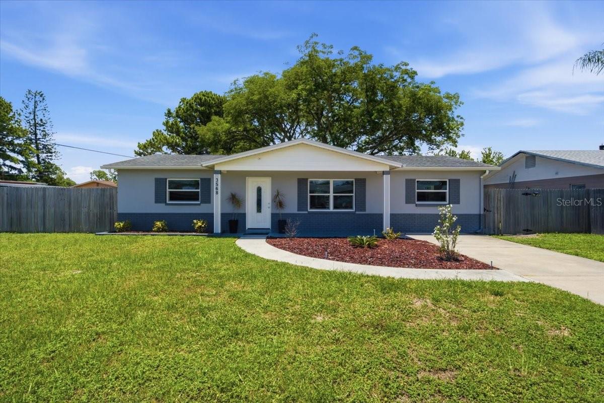 Welcome to this thoughtfully updated and move-in ready home in the heart of Largo. Constructed with durable block on a slab foundation, this 3-bedroom, 1-bath residence offers comfortable living, modern finishes, and a functional layout designed for everyday life. The open-concept kitchen serves as the centerpiece of the home, featuring a large island with ample seating that flows seamlessly into the main living area—perfect for entertaining or gathering with family and friends. Luxury vinyl plank flooring runs throughout the living spaces and bedrooms, while the bathroom is finished with tile for easy maintenance and timeless appeal. Step outside to enjoy the spacious backyard, highlighted by a beautiful mature shade tree that creates the perfect setting for outdoor activities, gardening, pets, or simply relaxing. A covered and screened patio extends the living space outdoors, providing a comfortable place to enjoy Florida's weather year-round. Conveniently located near shopping, dining, parks, and Gulf beaches, this well-maintained home offers a wonderful opportunity for first-time buyers, down-sizers, or anyone looking for a move-in ready property in a central Pinellas County location.